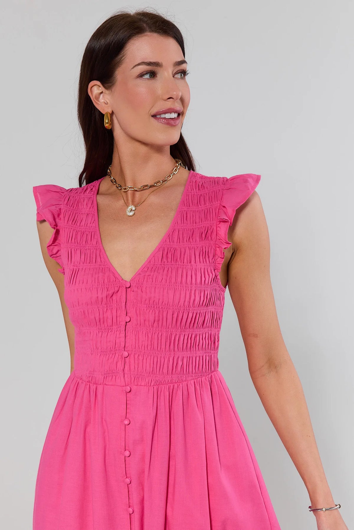 Close-up of pink smocked bodice detail and ruffle sleeves on Allyn Pink Smocked Midi Dress | Avara