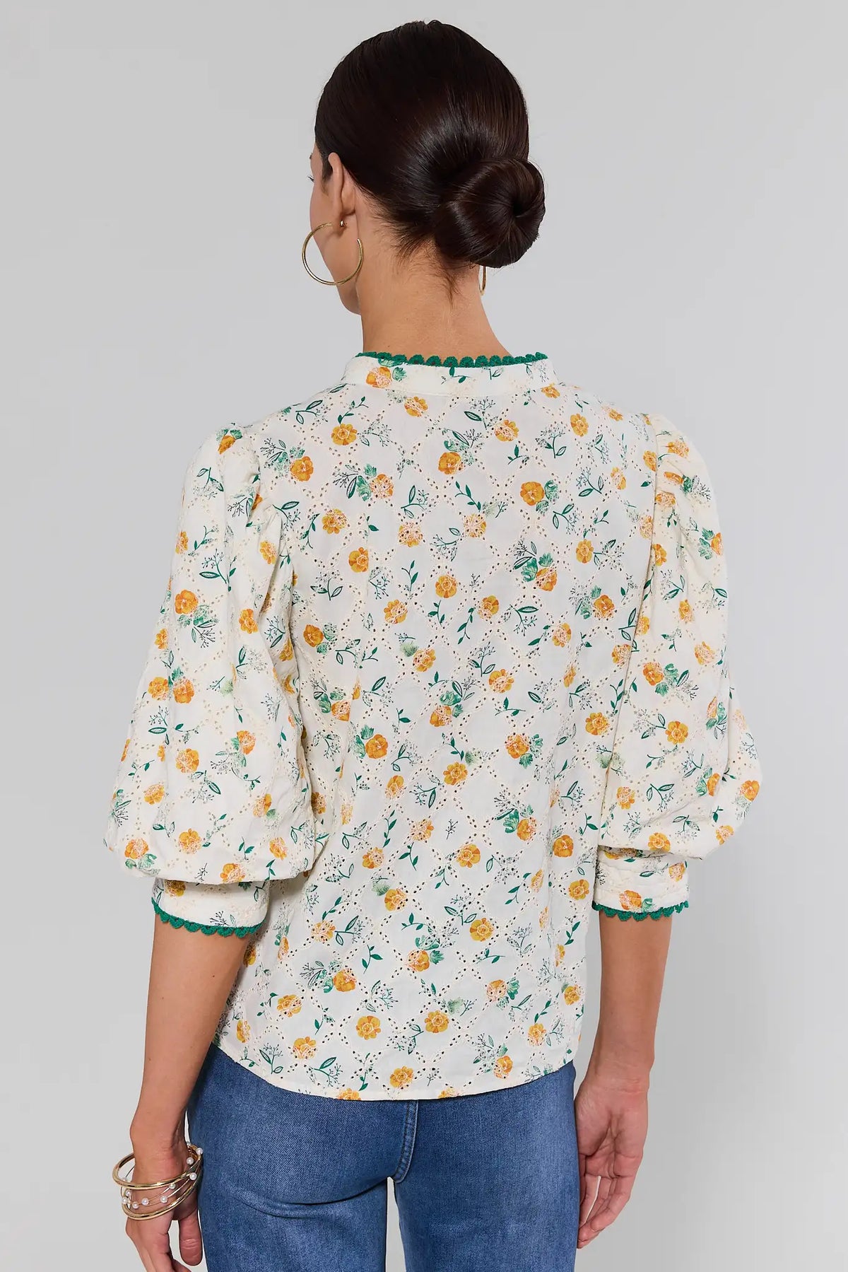 Cece Ivory Floral Eyelet Top with puff sleeves styled with denim - Back View | Avara