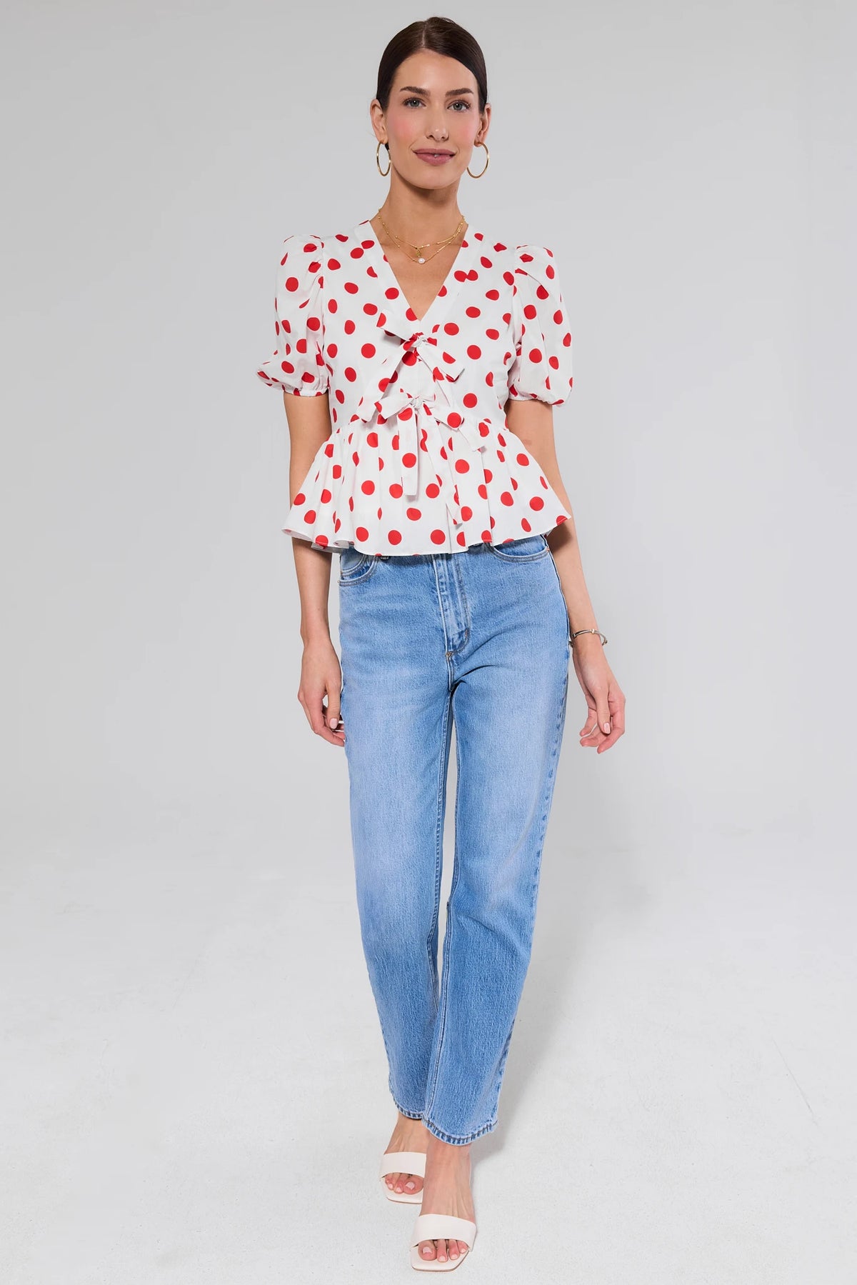 Georgie Red and White Polka Dot Peplum Top styled with blue jeans - Full Length View | Avara