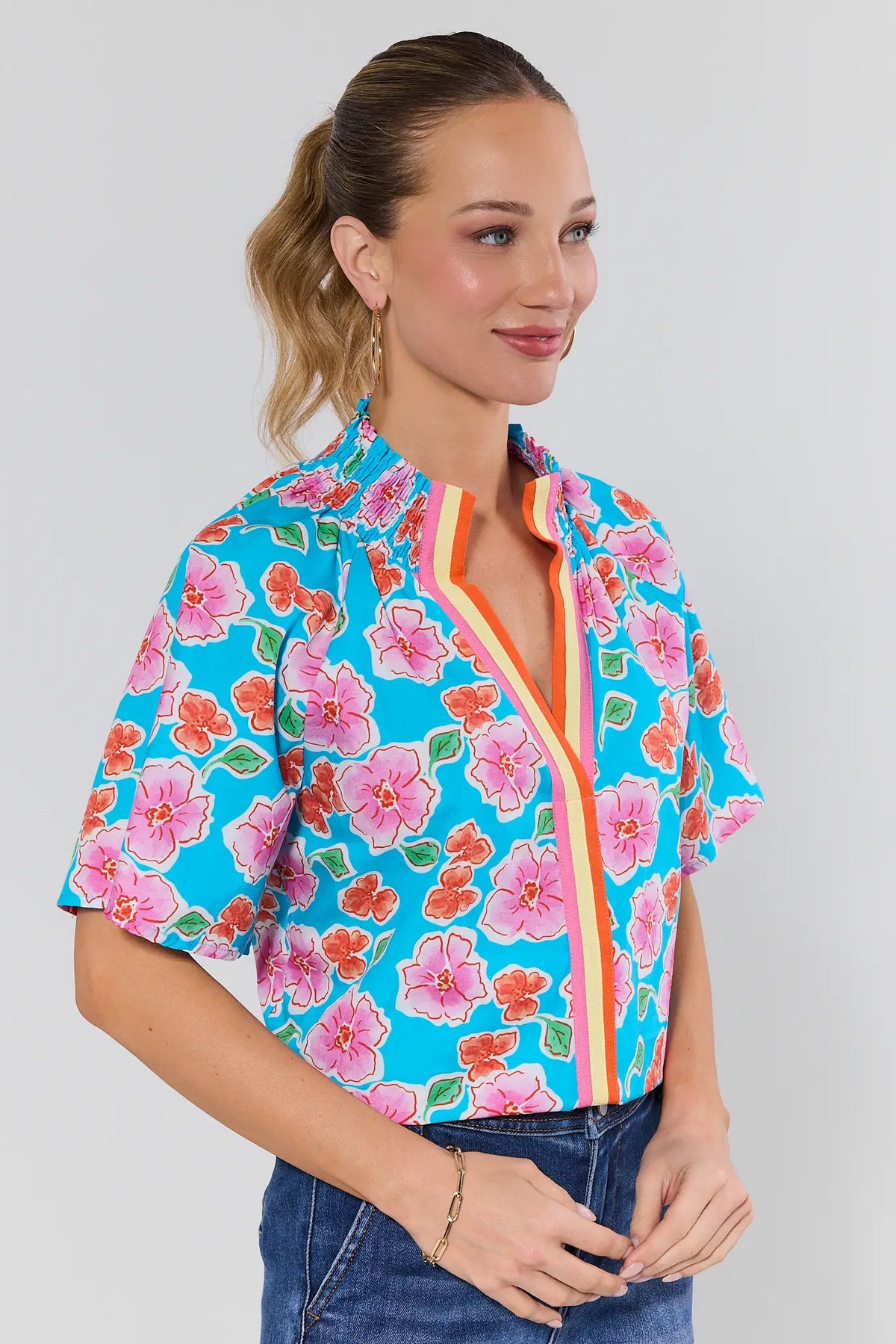 Macey Blue Floral Print Top by THML - Side View, colorful floral top styled with denim | Avara