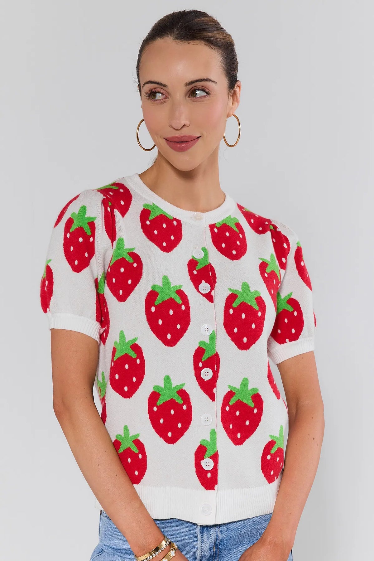 Woman wearing white intarsia-knit strawberry sweater with button front, short sleeves - Front View | Avara
