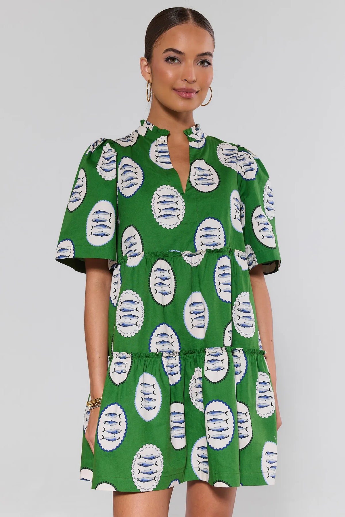 Evan Green Printed Short Dress with sardine print, tiered silhouette, front view on model | Avara