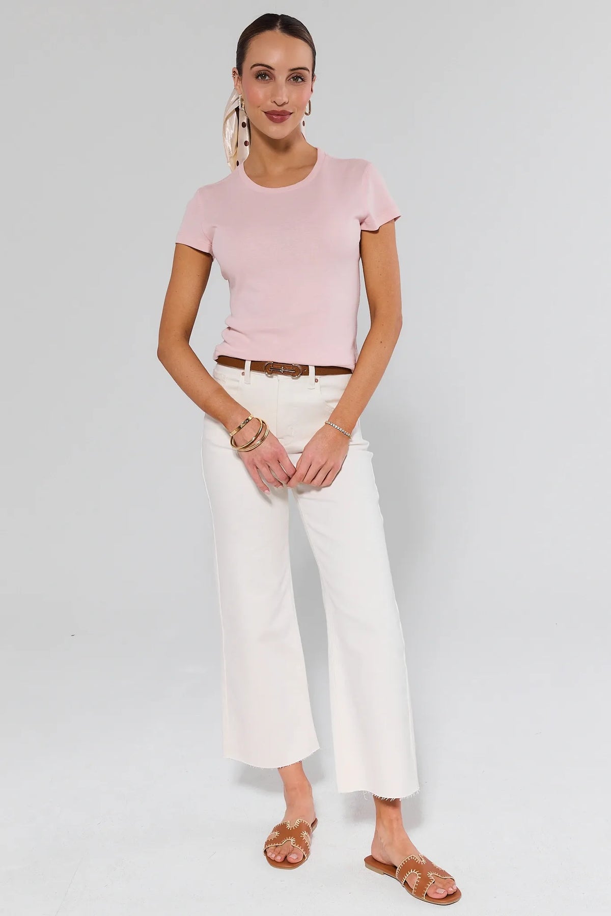 Caroline Ecru Straight Leg Jeans styled with pink tee, brown belt, and tan sandals, full-length on-model view | Avara
