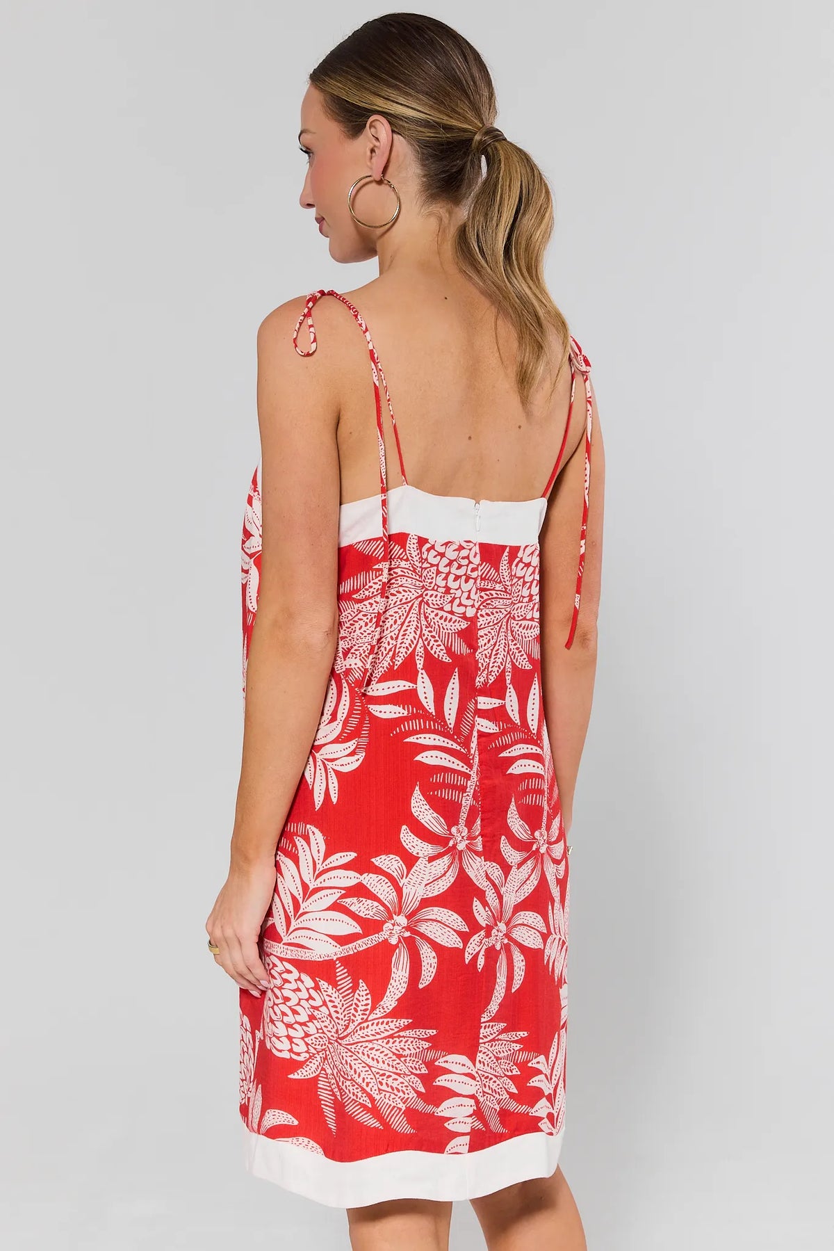 Libby Red Printed Short Dress - back view showing zip closure, white trim hem, tie straps | Avara