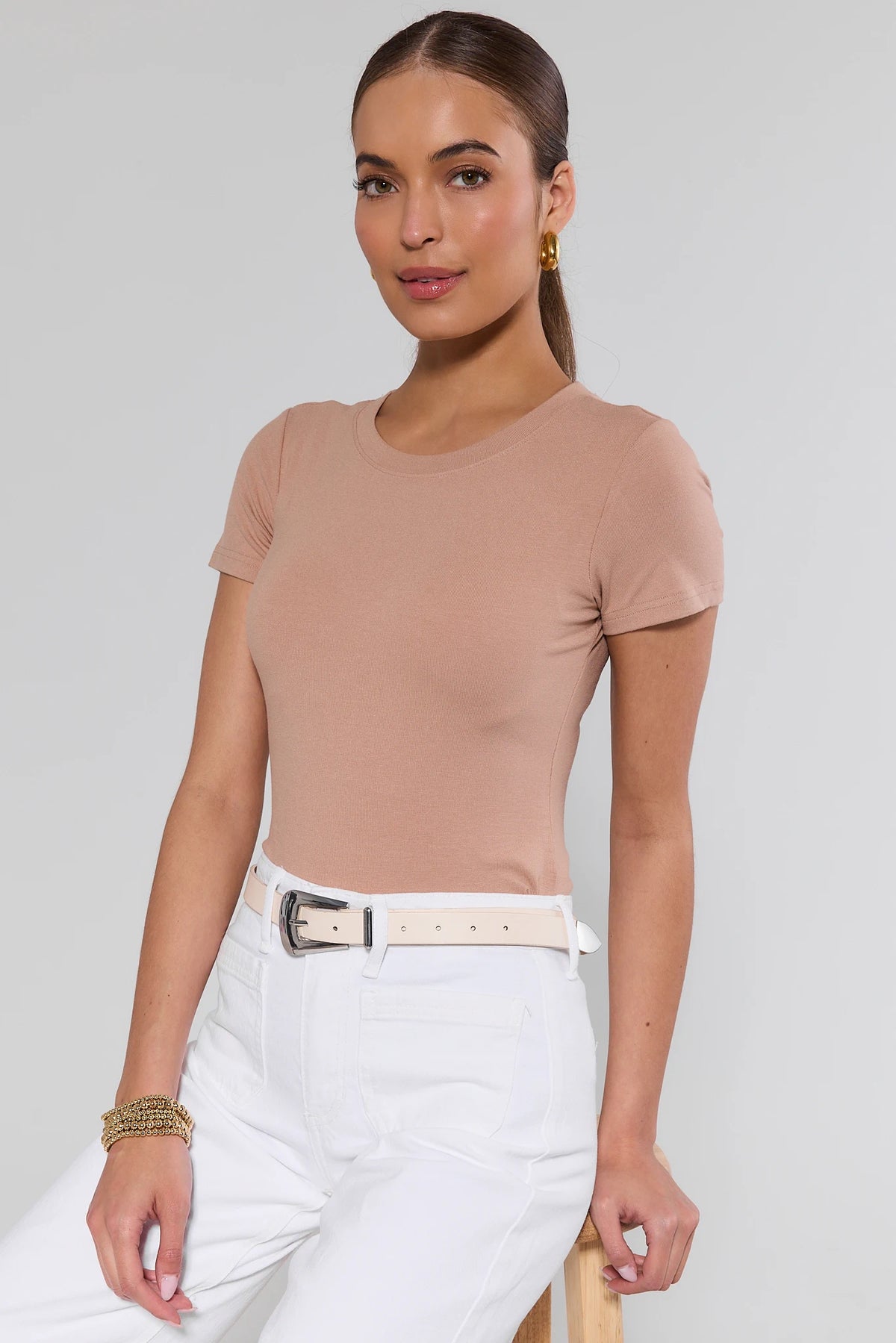 Boston Ivory Faux Leather Belt styled on model with white jeans and tan top - On Model | Avara