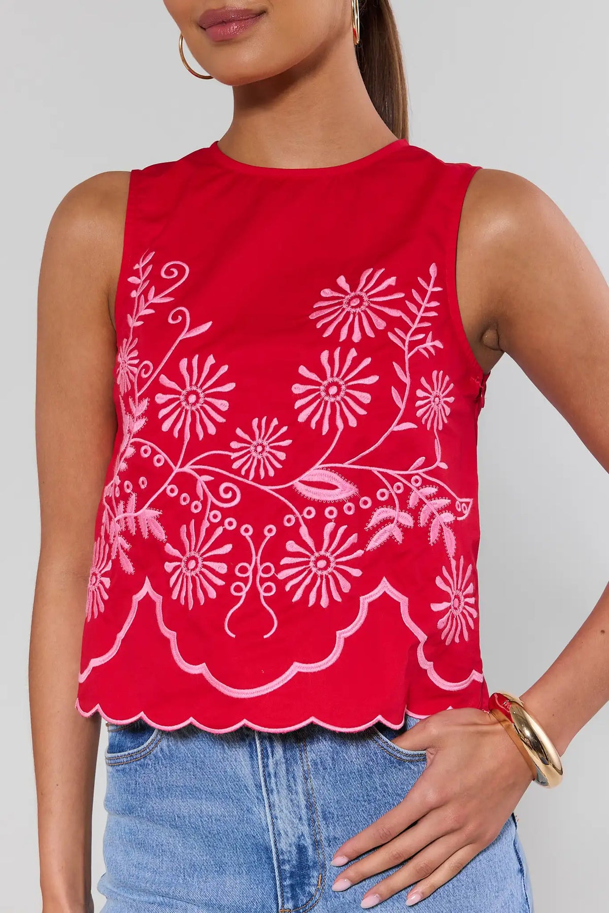 Maisy Red Embroidered Tank Top close-up showing pink floral embroidery and scalloped hem detail | Avara