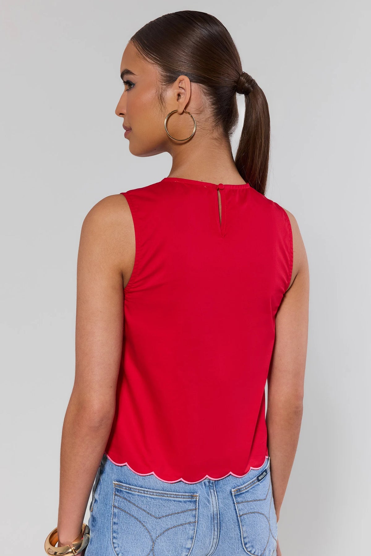 Maisy Red Embroidered Tank Top back view with keyhole closure and scalloped hem, styled with denim | Avara