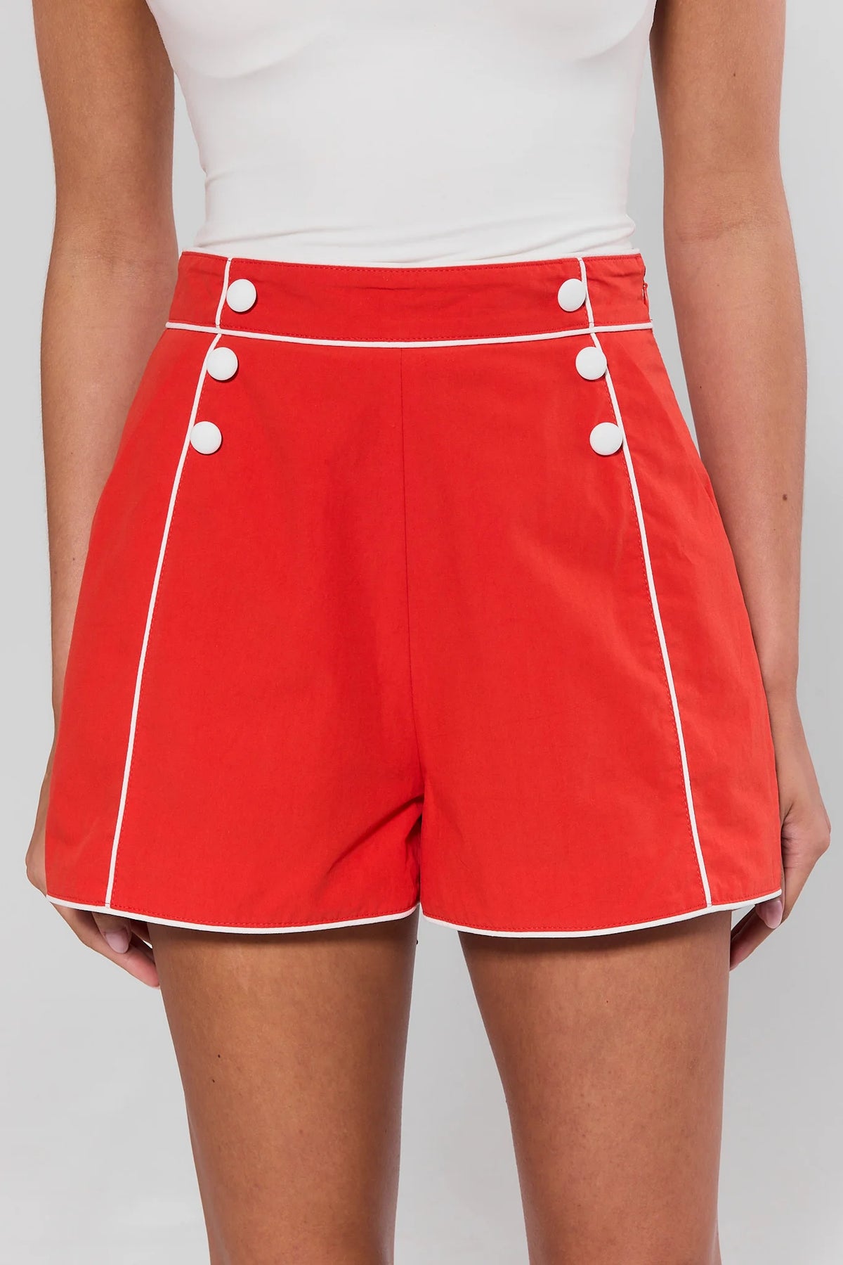 Belle Red Contrast Trim Shorts with white piping and buttons, front close-up view | Avara