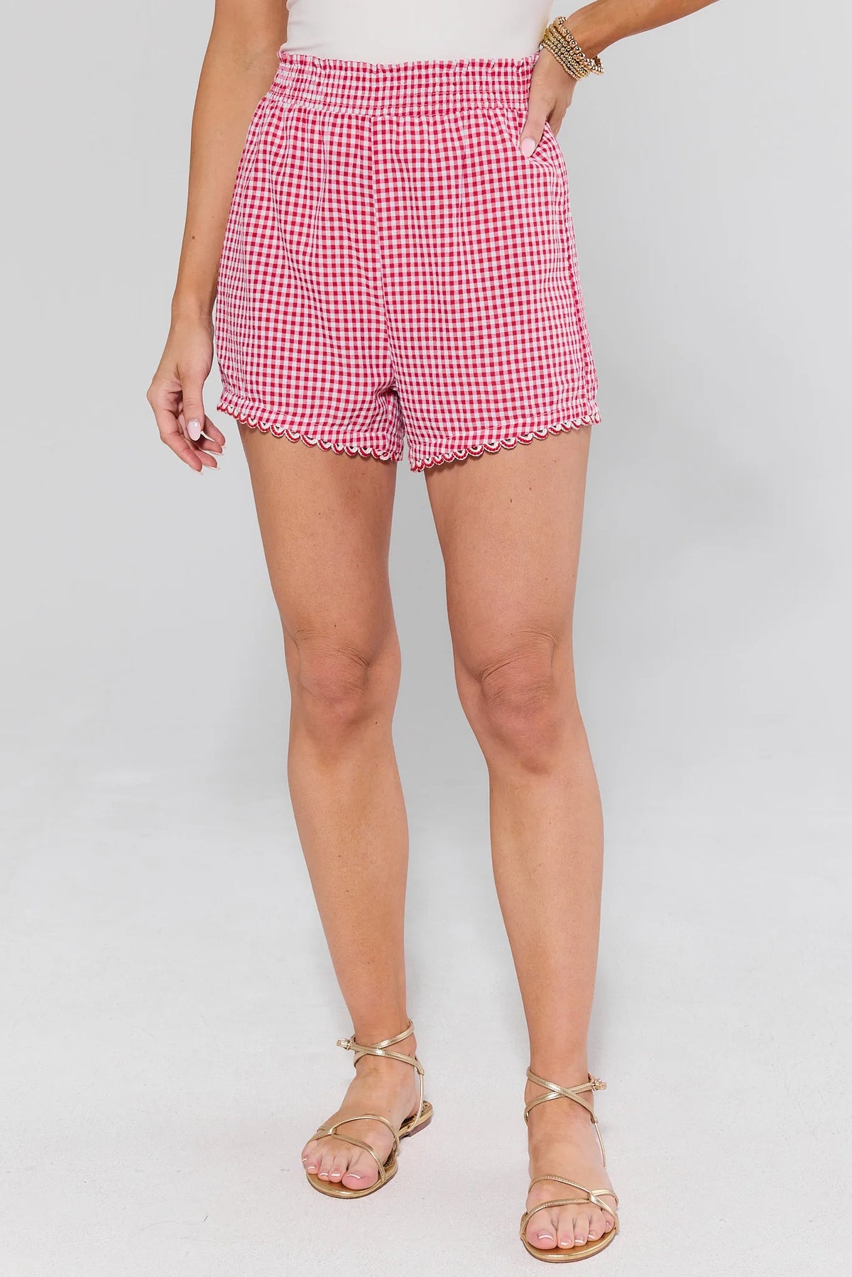 Red Gingham Mini Shorts with gold sandals and smocked waist - On Model Front View | Avara