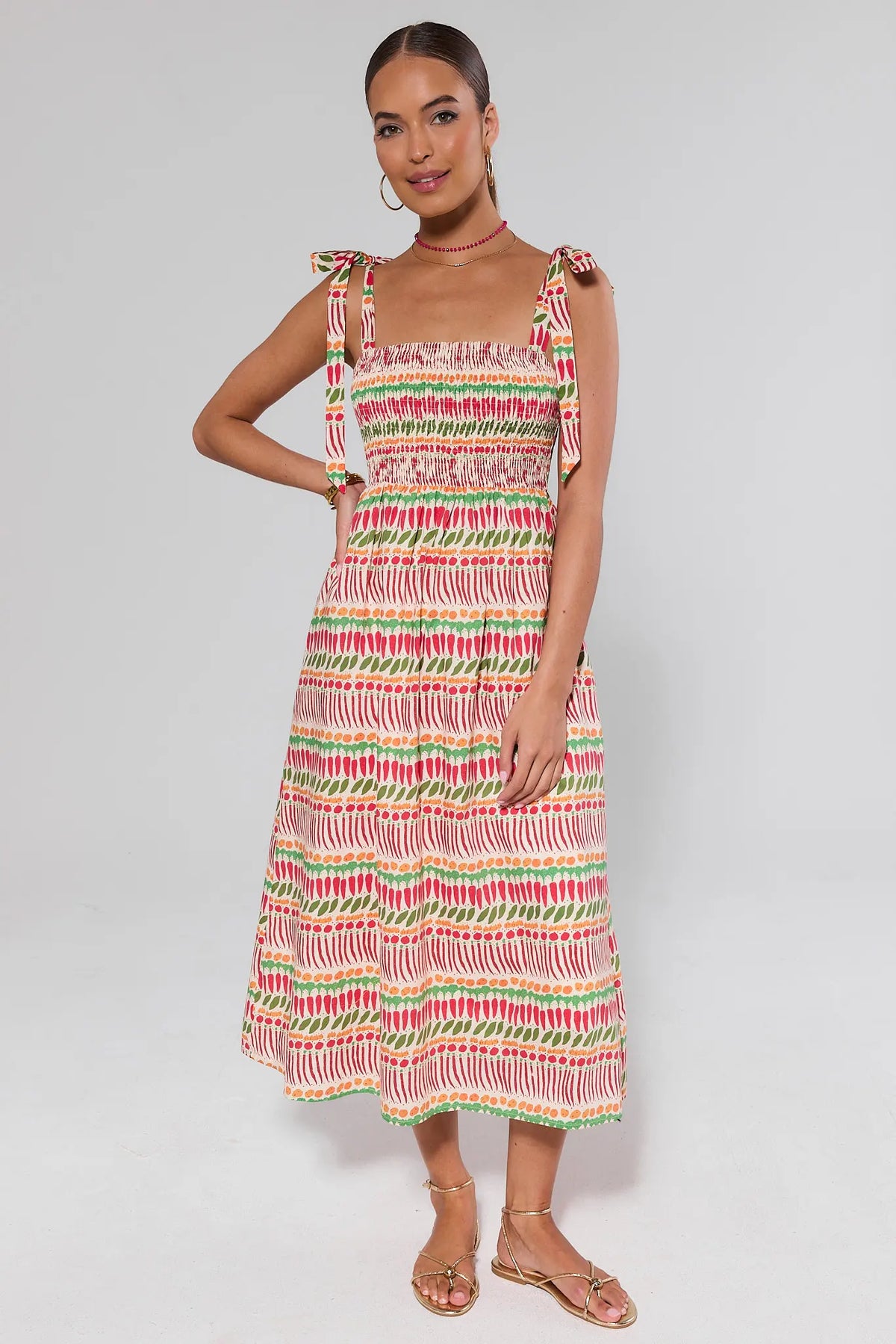 Multi-Printed Smocked Maxi Dress with tie straps, front view on model - colorful vegetable print | Avara