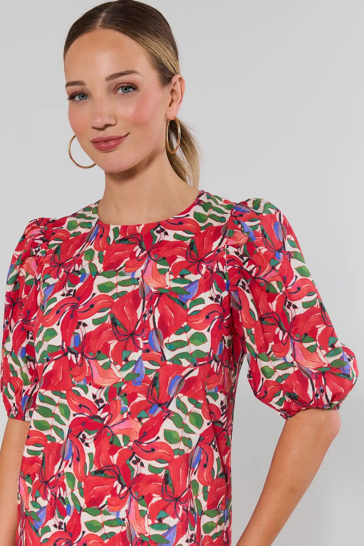 Red print shift dress close-up of puff sleeve and round neckline detail | Avara
