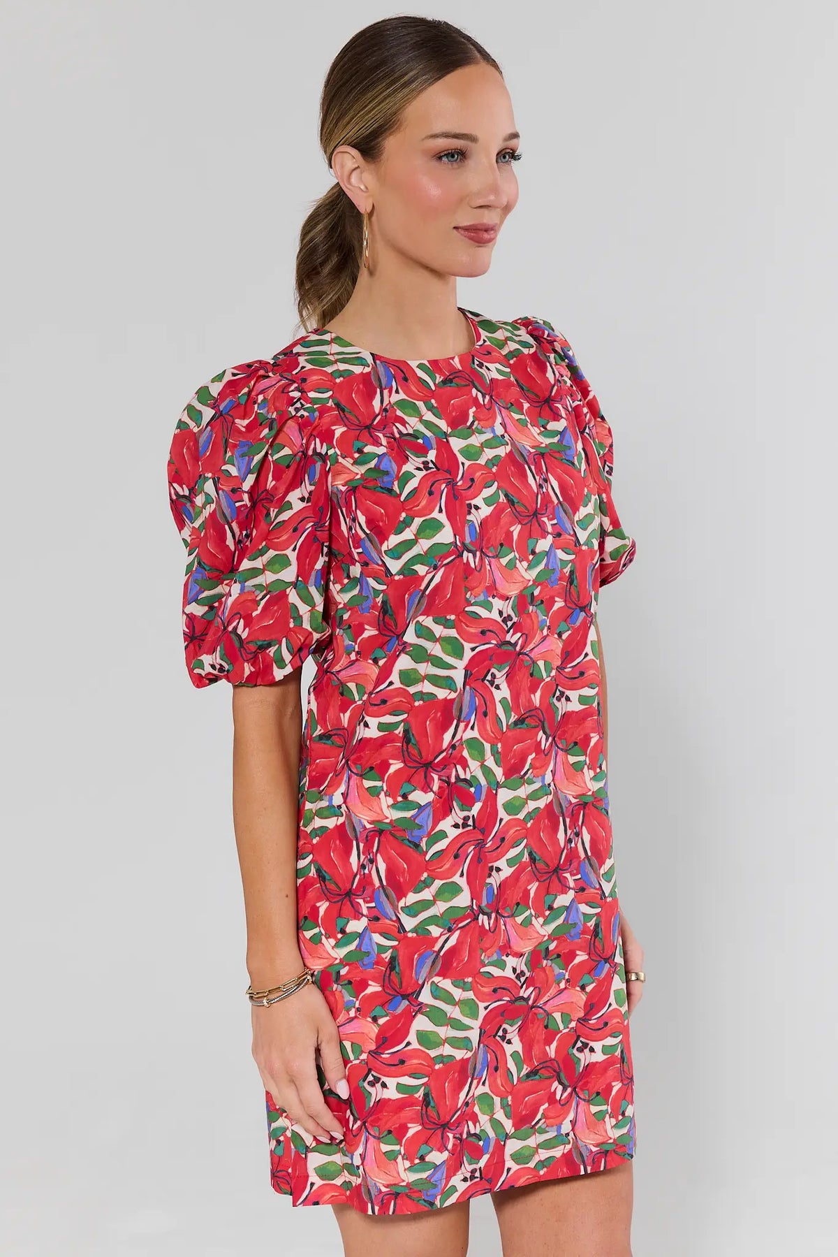 Red floral print shift dress side angle showing puff sleeve and relaxed silhouette | Avara