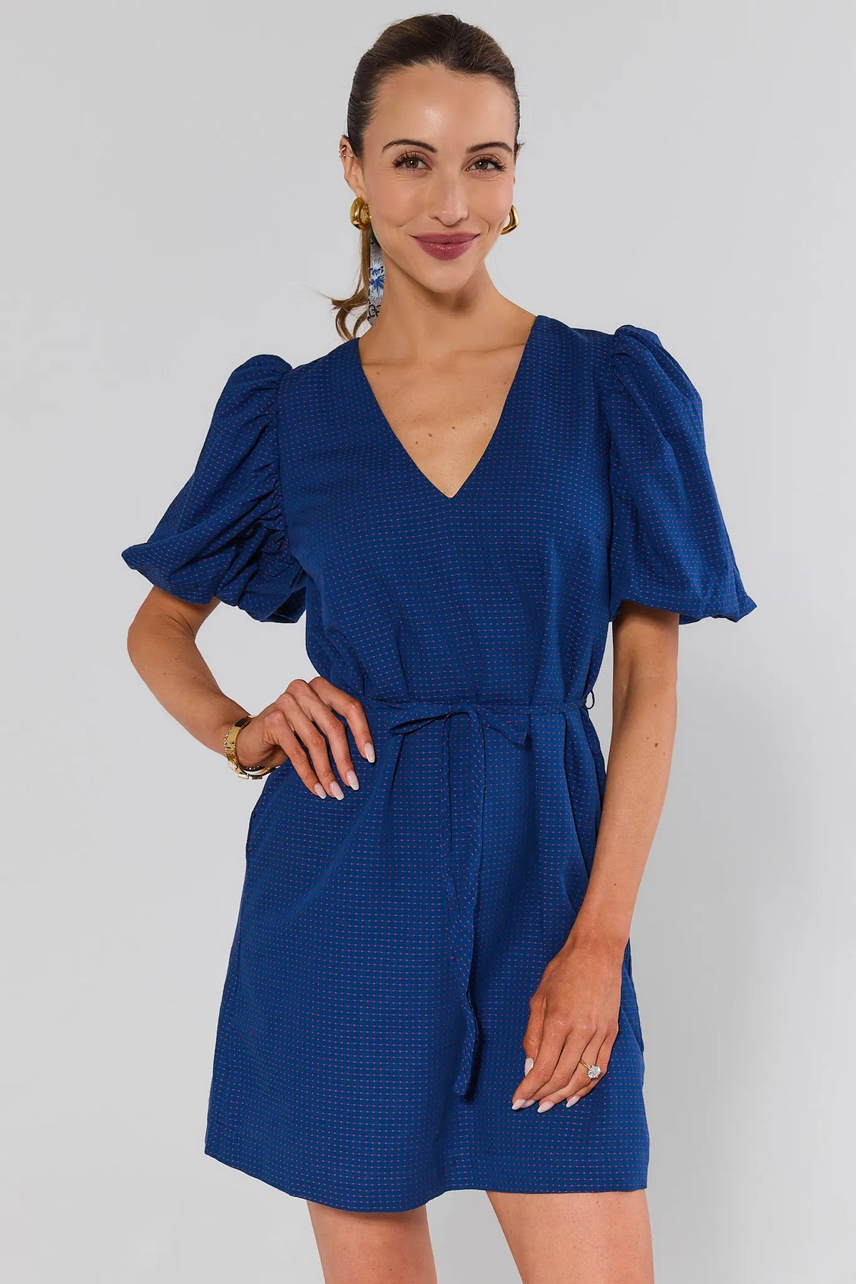 Navy embroidered dot puff sleeve short dress with V-neckline and tie waist - Front View | Avara