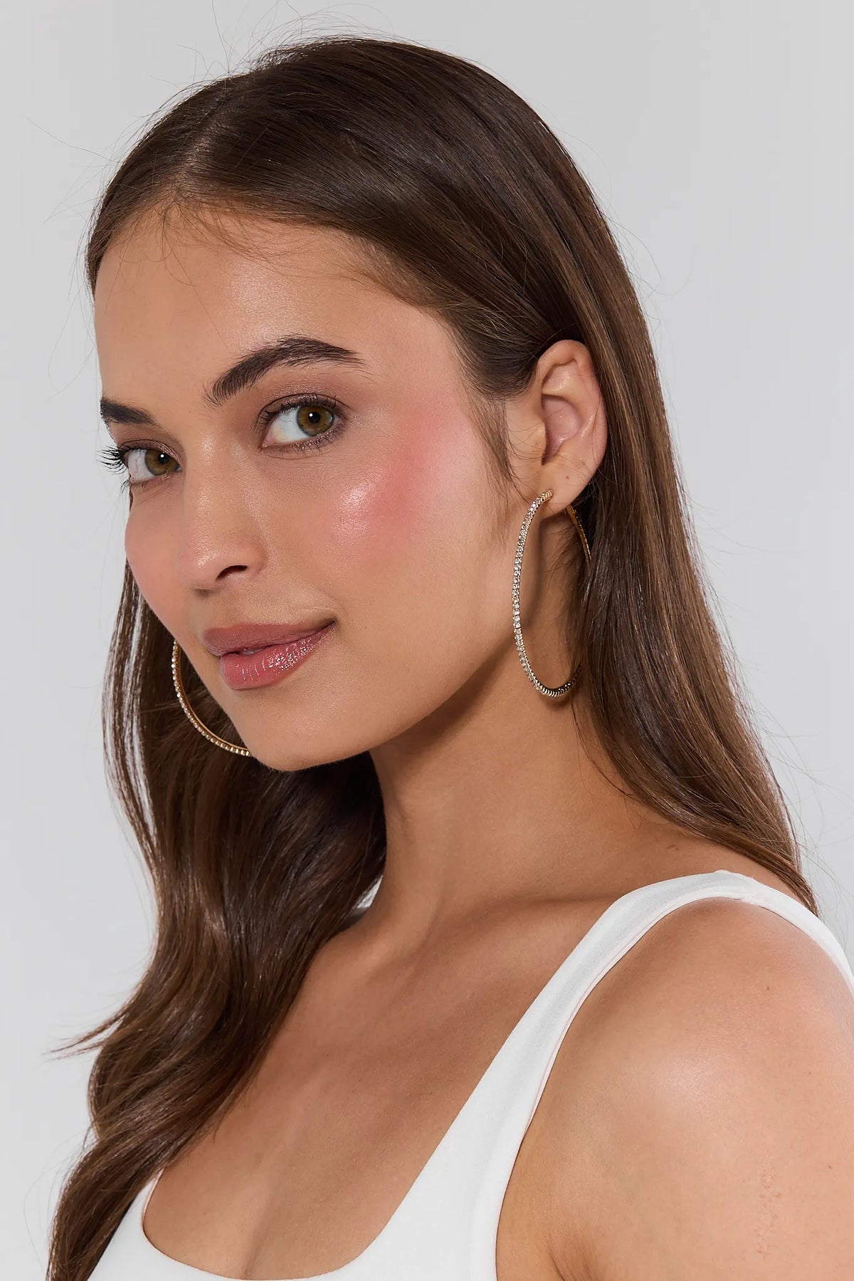 Woman wearing gold rhinestone hoop earrings - Side Profile On Model, sparkling crystal hoops | Avara
