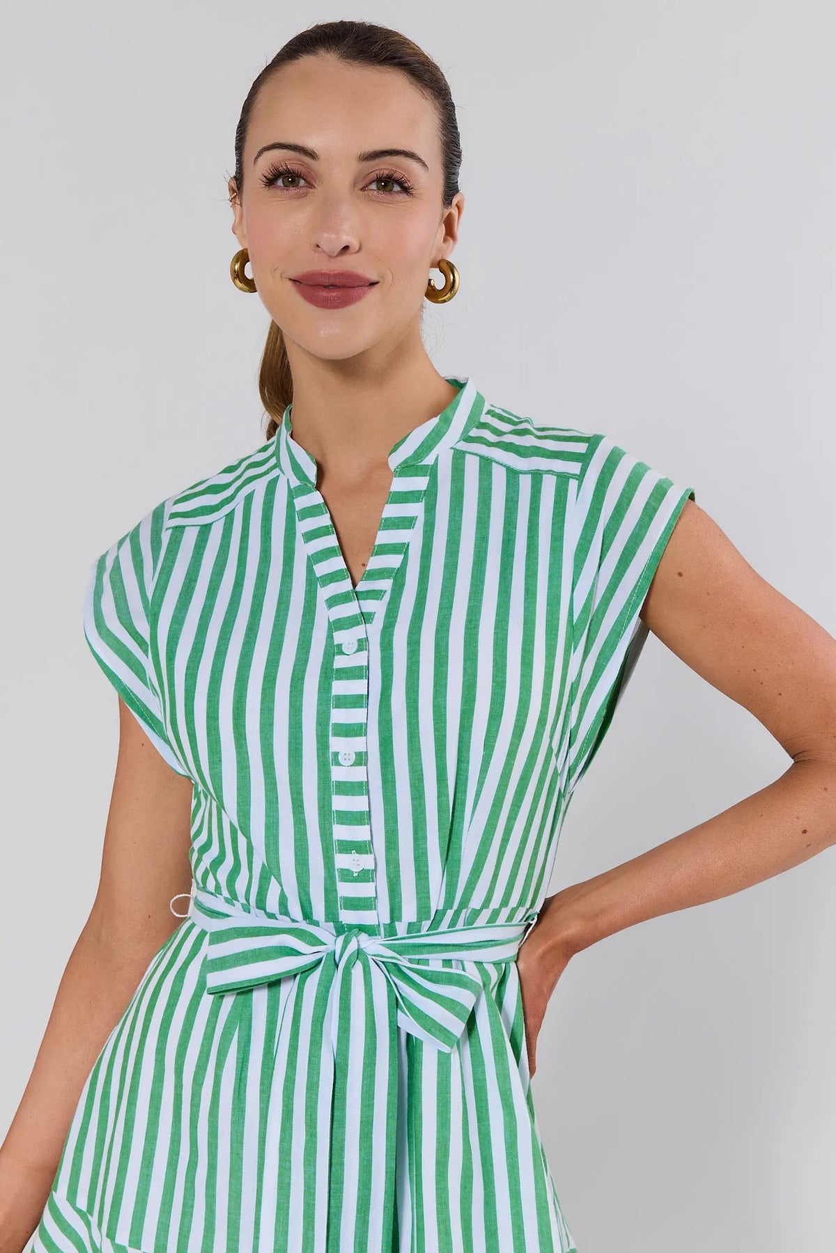 Erica Green Striped Short Dress - Close-Up Detail of V-neckline, button front, and tie waist | Avara