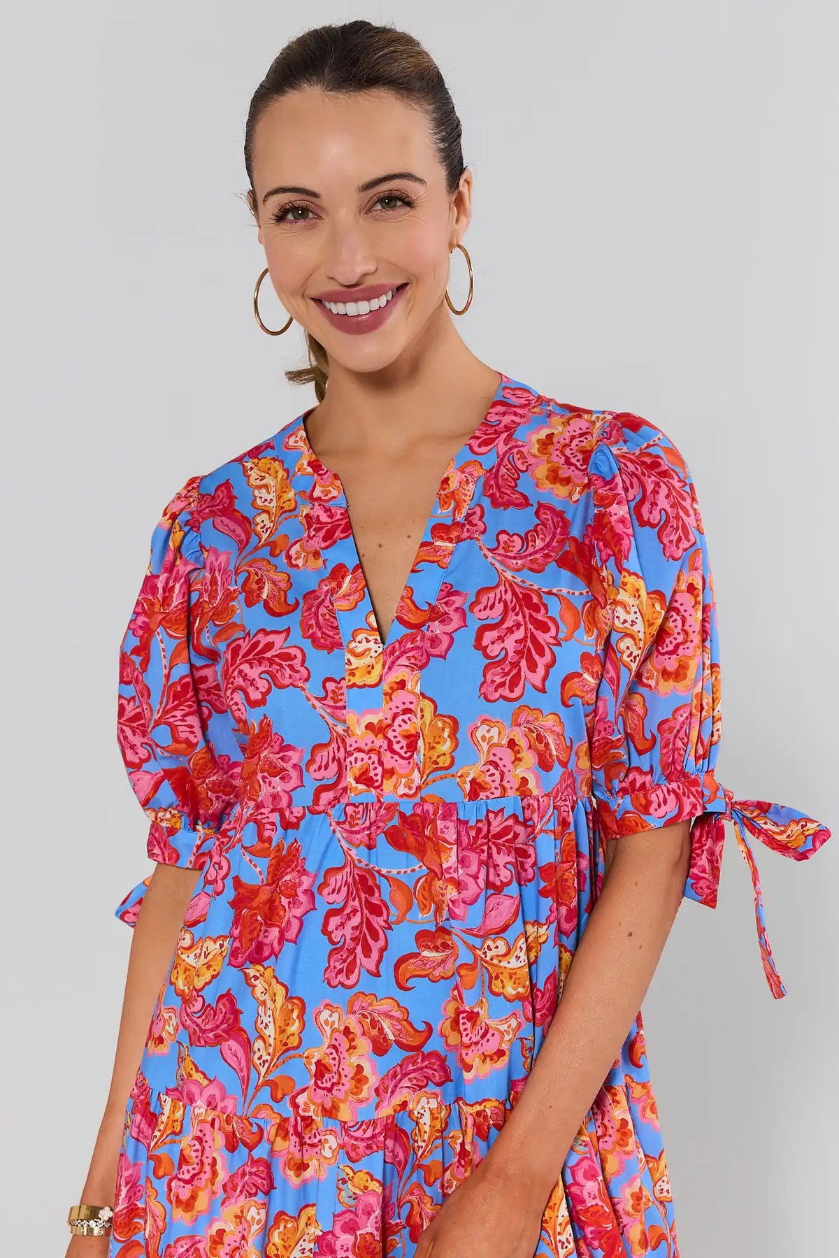 Harriet Blue Floral Printed Midi Dress - Close-Up V-Neckline & Tie-Sleeve Detail | Avara