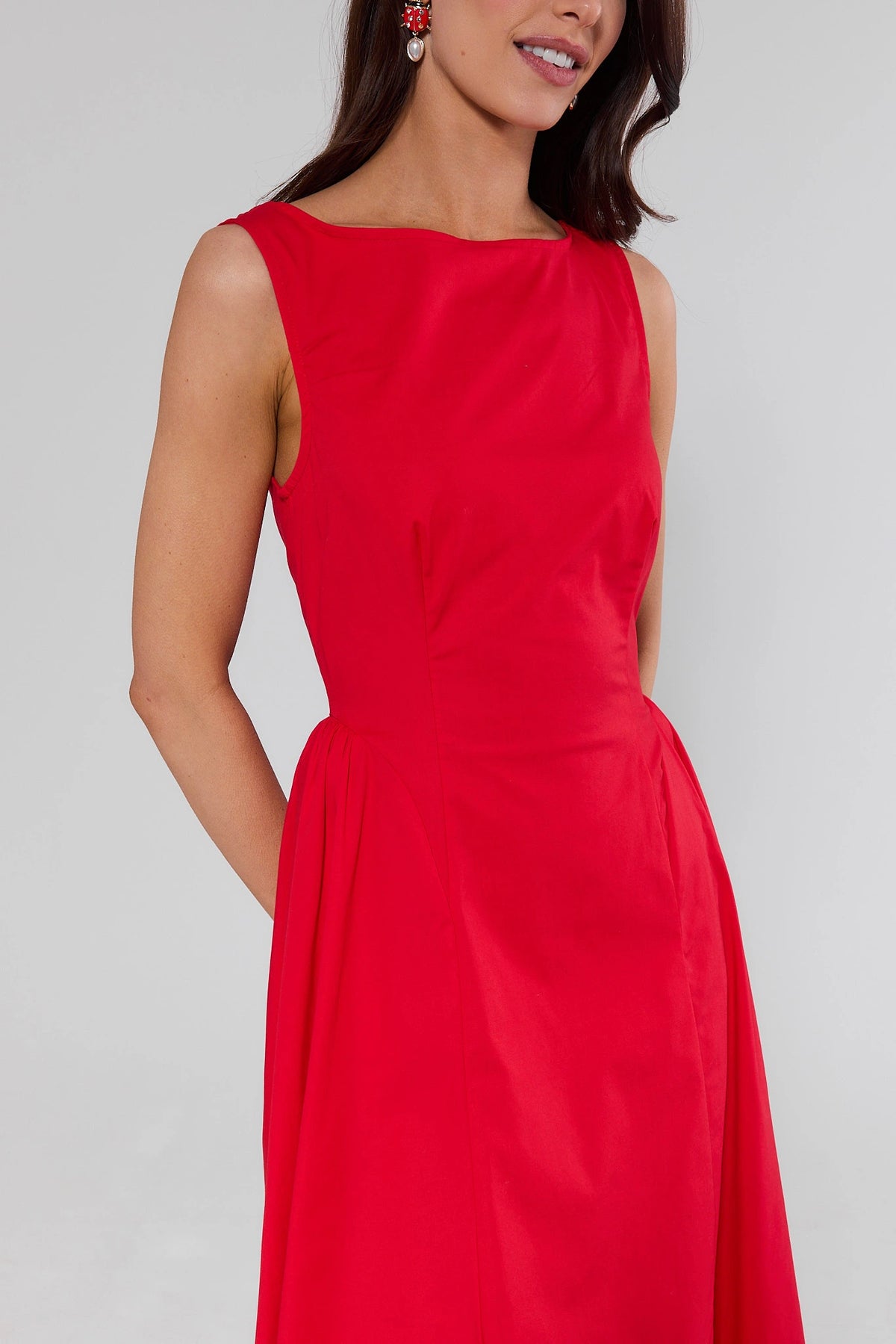 Red Boat Neck Midi Dress showing fitted waist and A-line skirt with pocket - Close-Up Front Detail | Avara