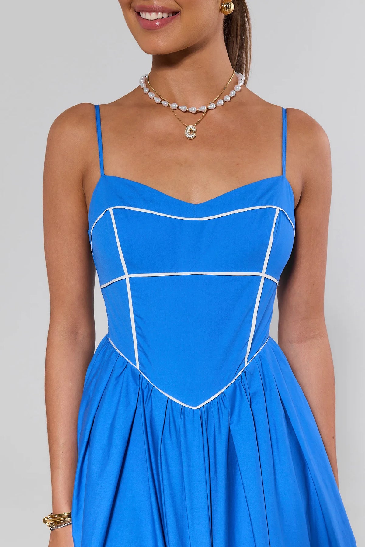 Blue contrast trim maxi dress white piping corset bodice close-up - Bodice Detail | Avara