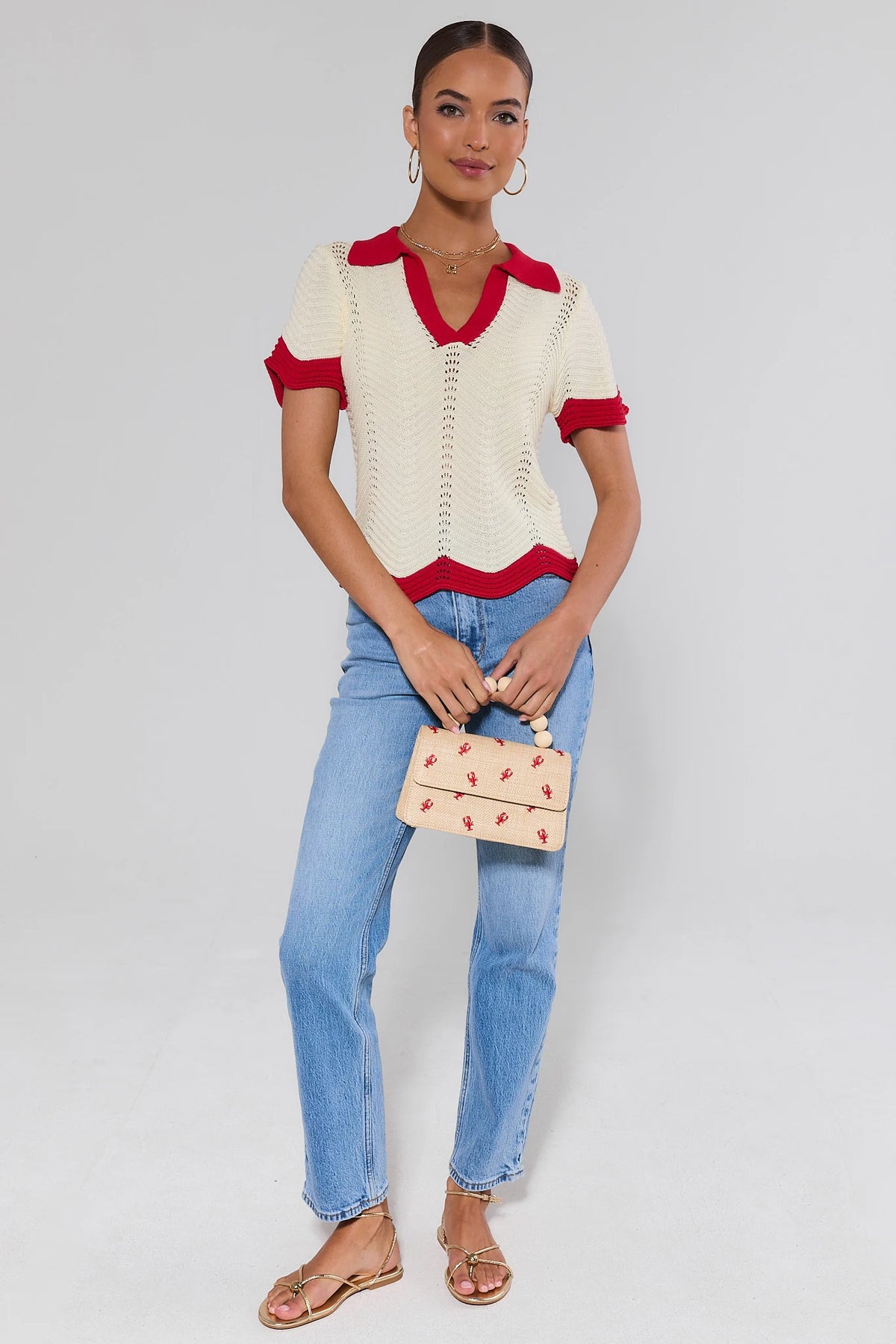 Ivory knit contrast trim top styled with blue jeans and straw bag - Full Length Styled Look | Avara
