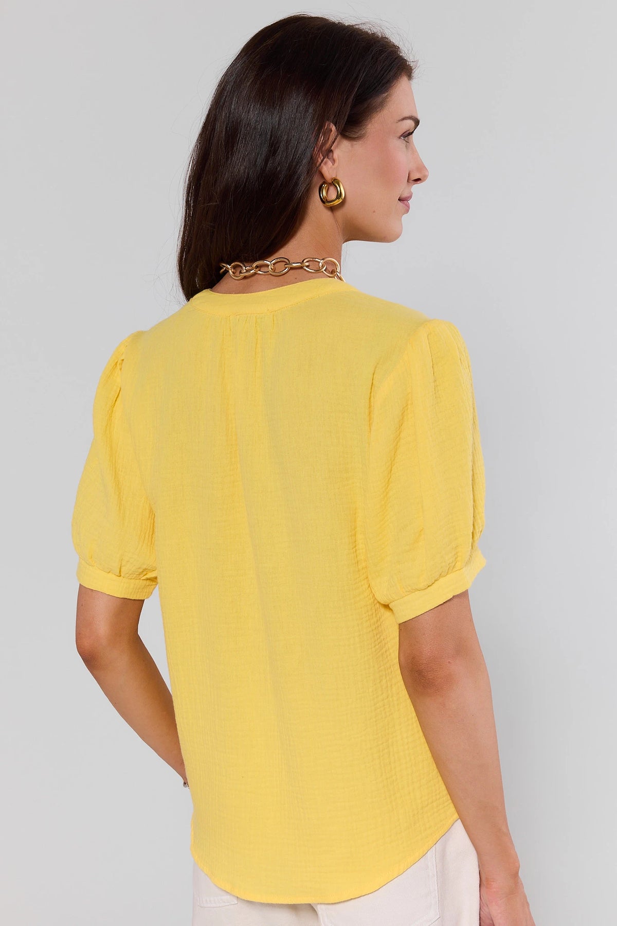 Yellow gauze top - back view showing puff sleeve and relaxed fit on model | Avara
