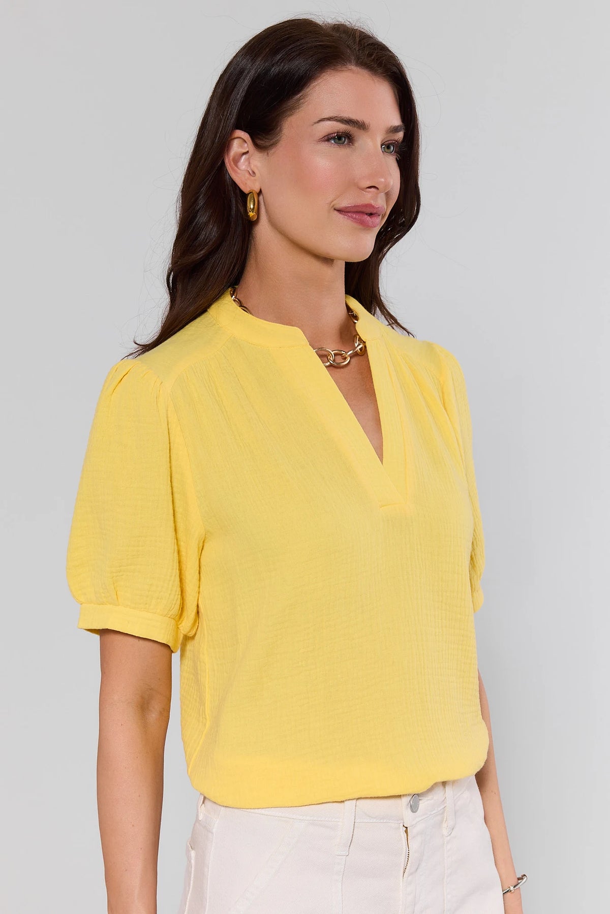 Yellow gauze puff sleeve top - 3/4 side angle view showing V-neckline detail | Avara