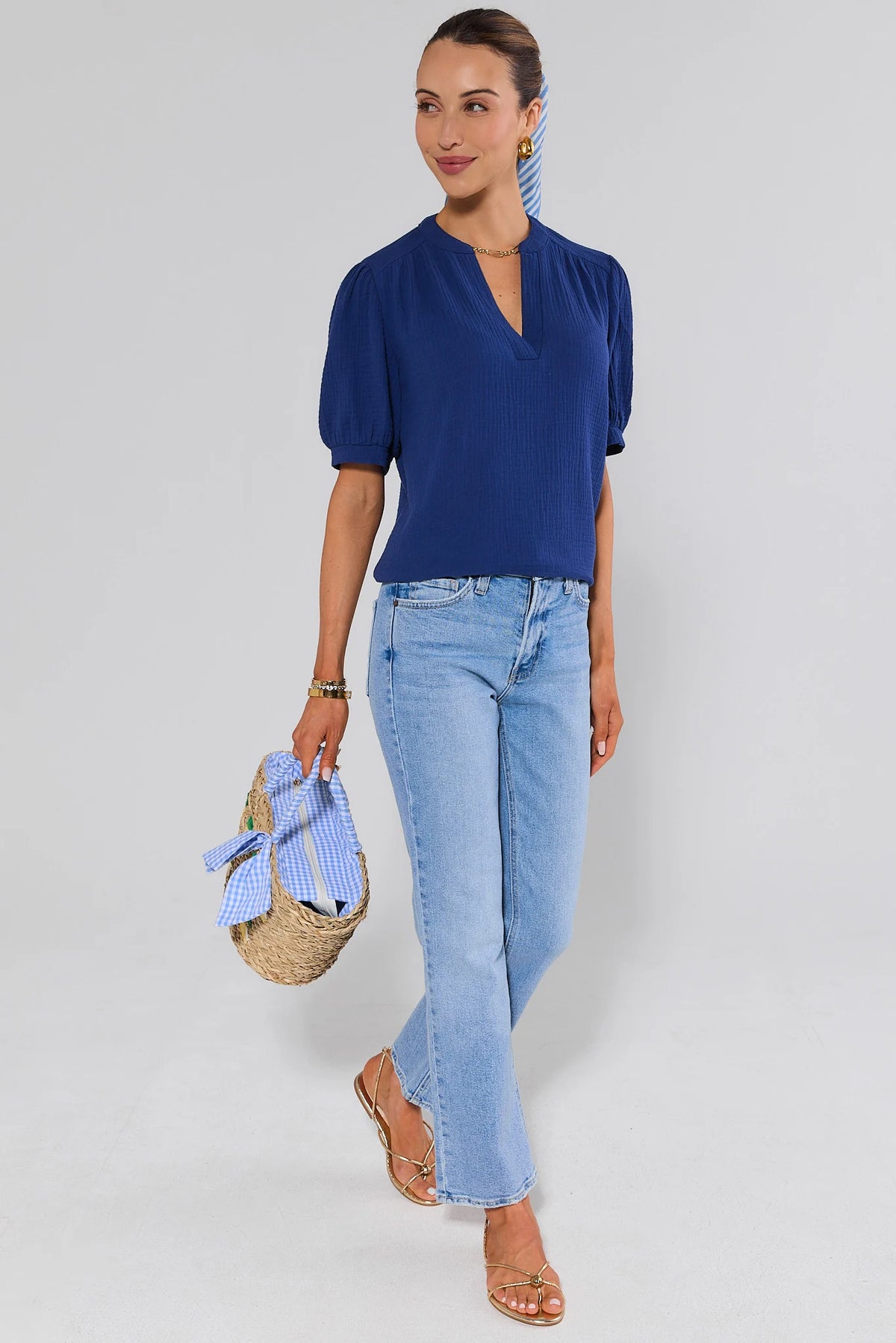Tammy Navy Gauze Top styled with light wash jeans, gold sandals, and straw bag — full-length outfit view | Avara