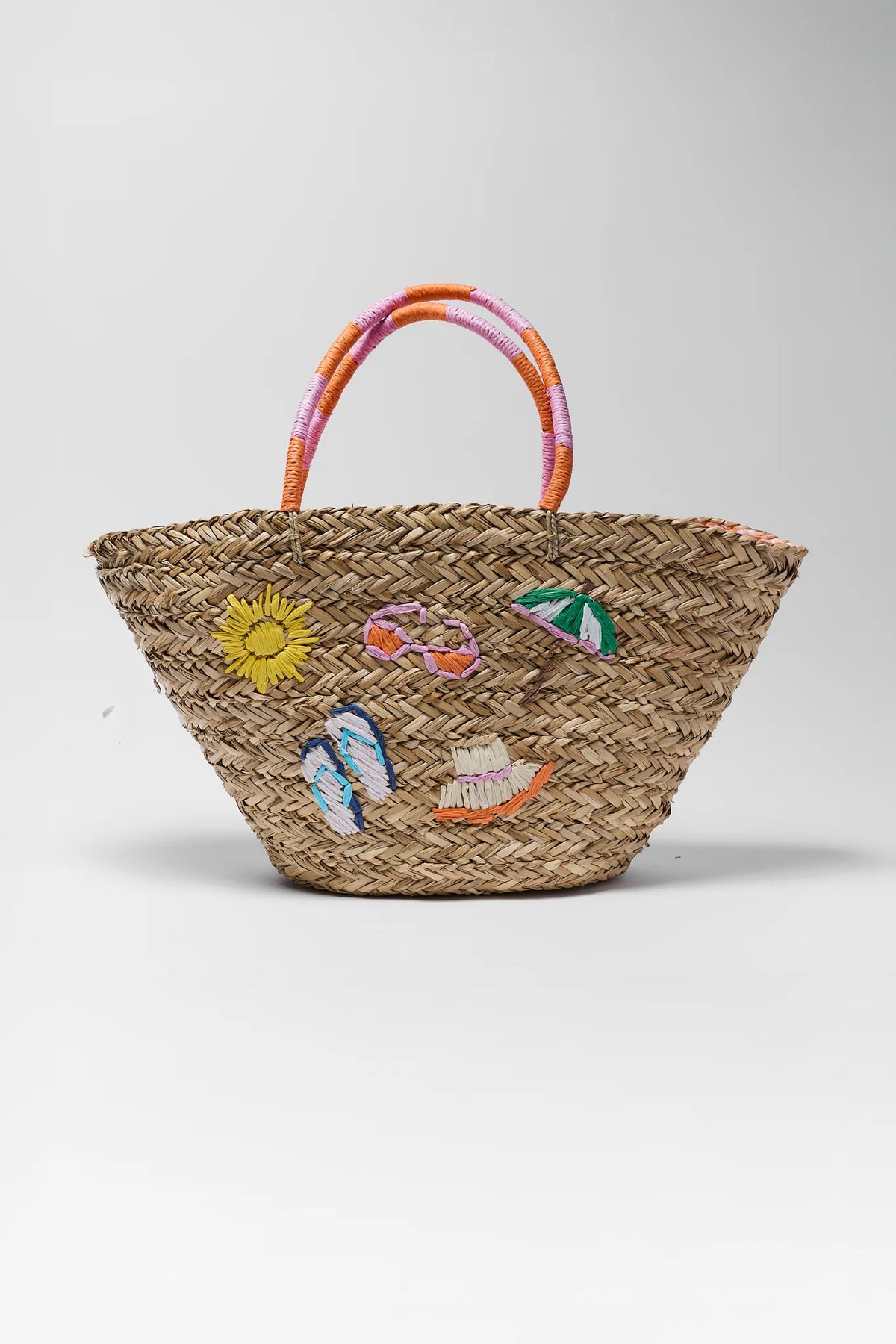 Natural woven raffia tote bag with beach icon embroidery and striped orange-pink handles - Front View | Avara