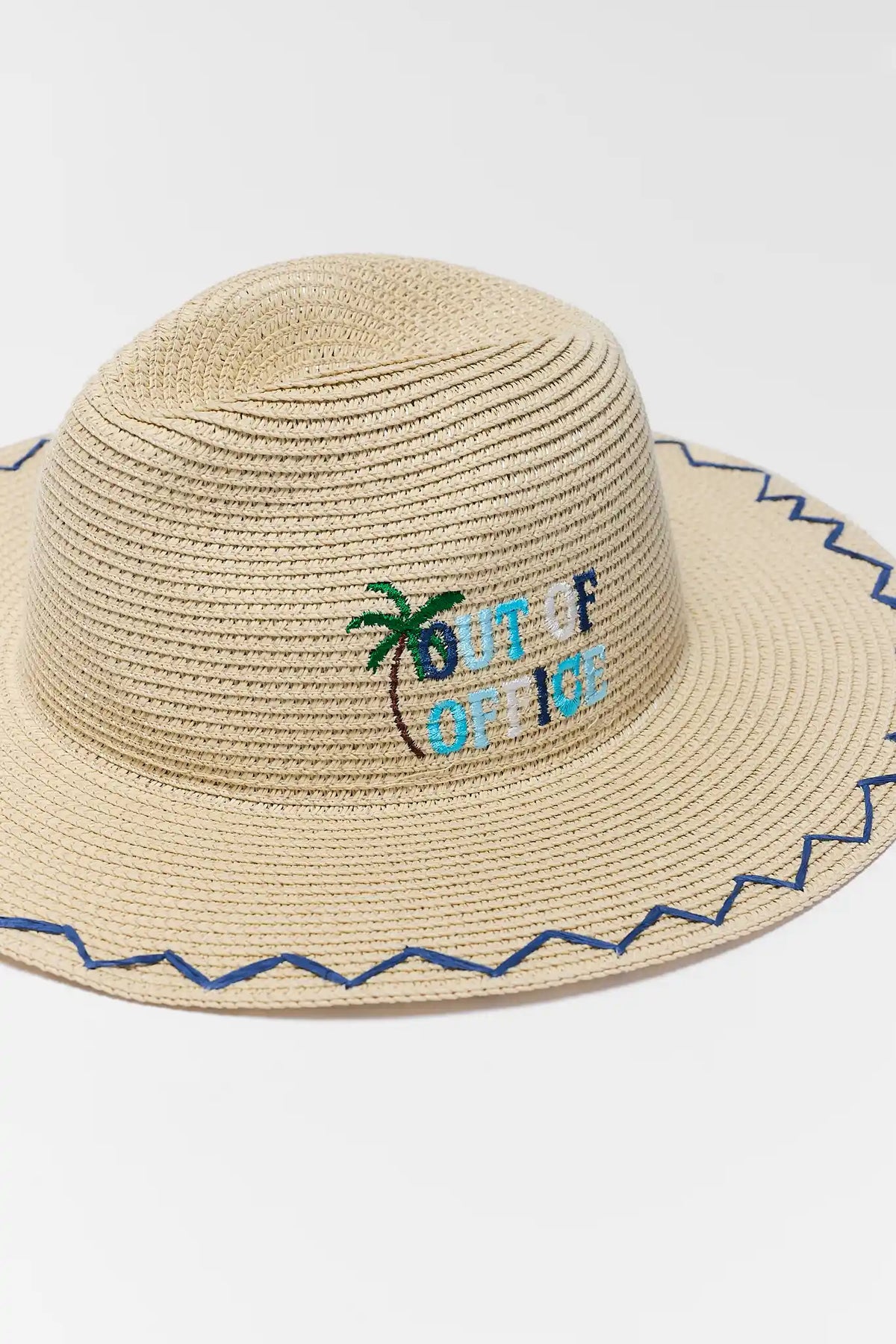 Beige raffia wide brim hat with 'Out of Office' palm tree embroidery and navy zigzag trim - Close-Up Detail | Avara