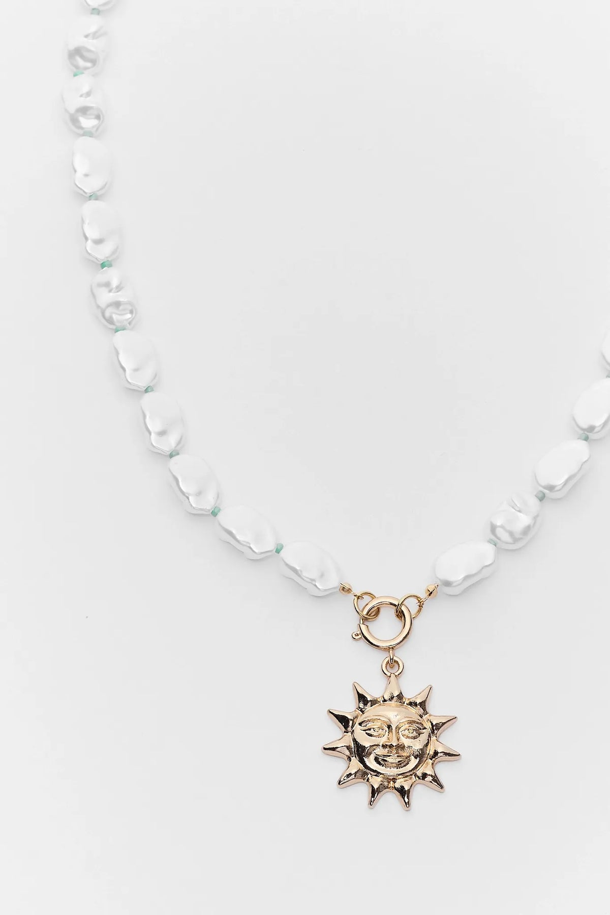 Pearl beaded necklace with gold sun face charm and teal accent beads - Close-Up Detail | Avara