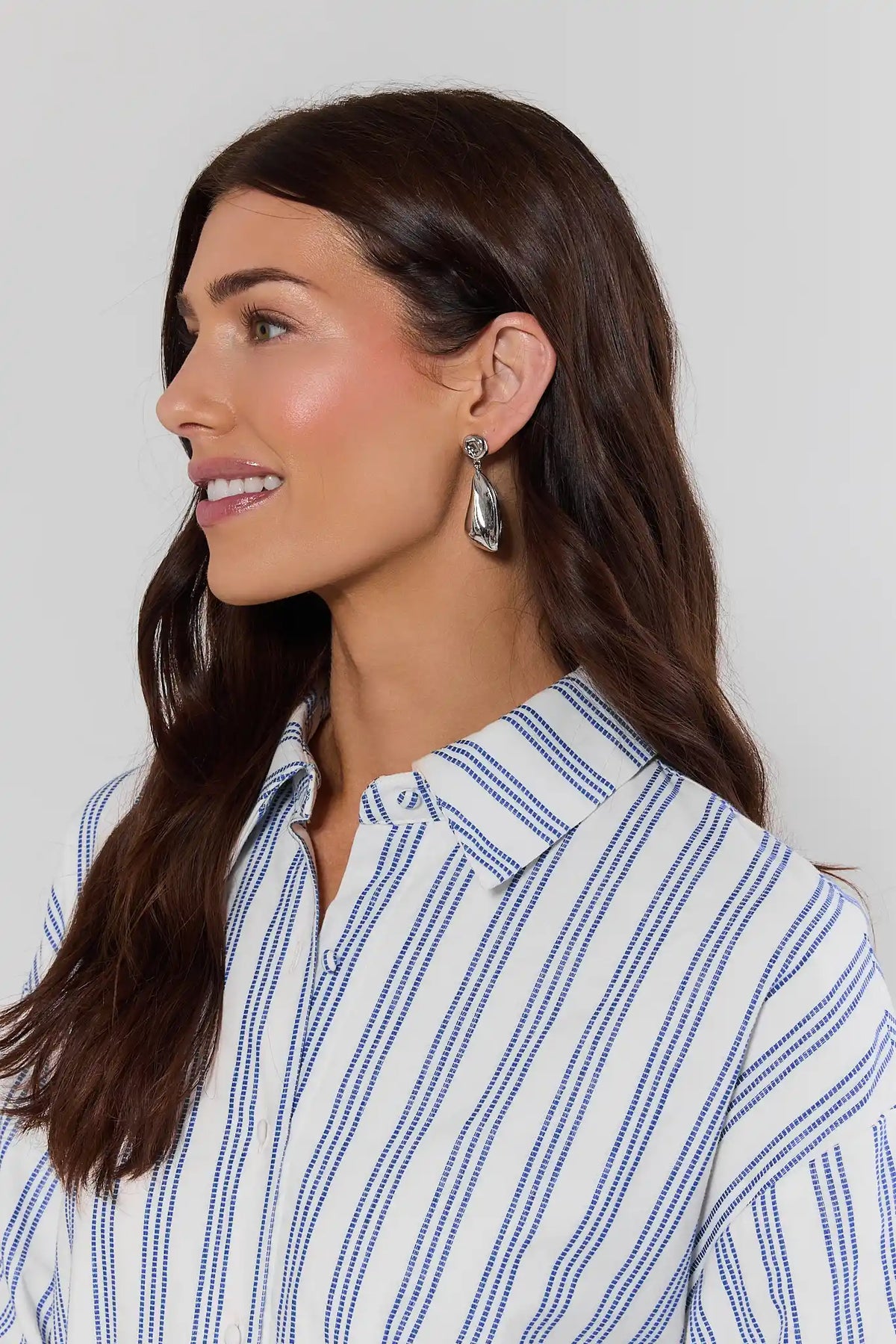 Woman wearing silver drop earrings with blue and white striped shirt - Side Profile On Model | Avara