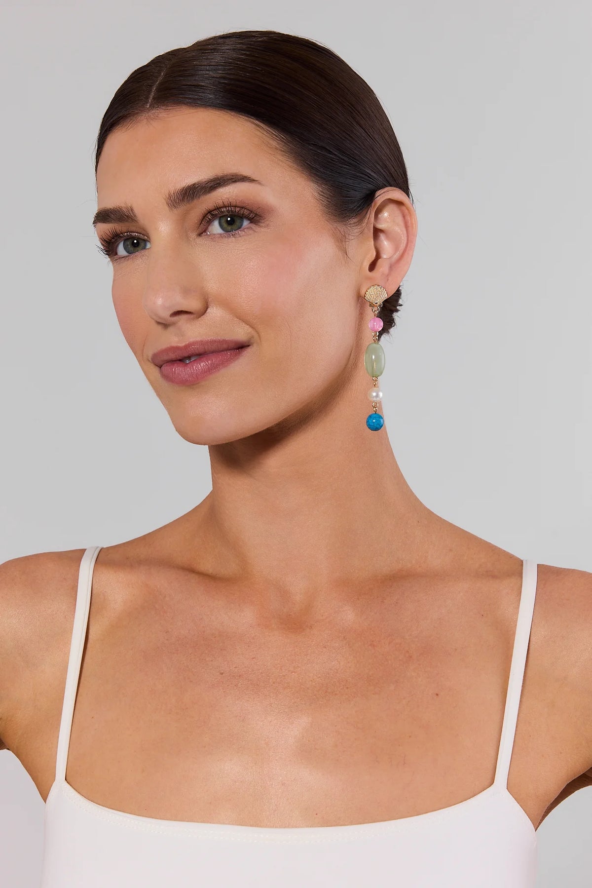 Woman wearing gold shell multi-stone drop earrings - On Model Side View | Avara