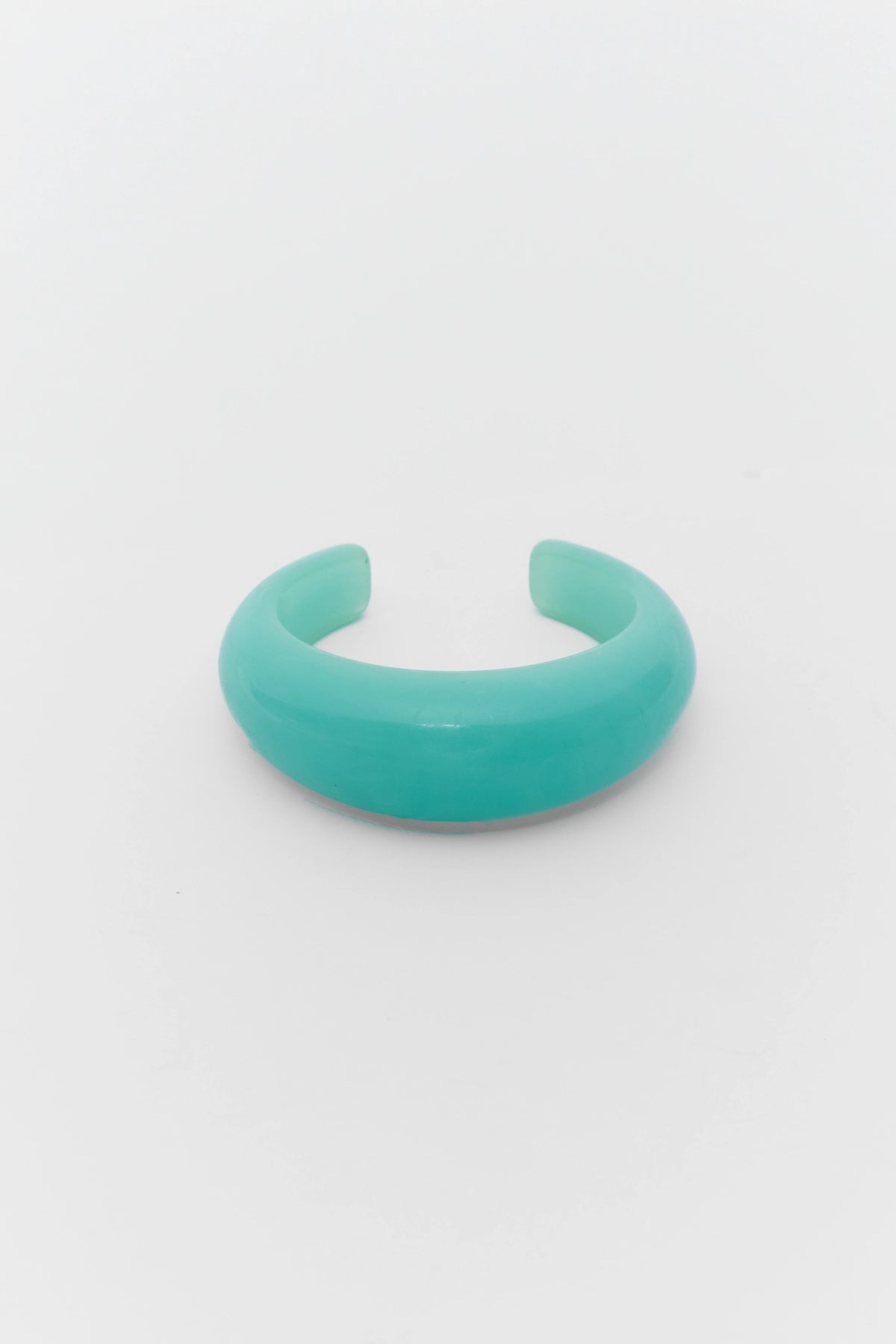 Turquoise bracelet on a light gray background