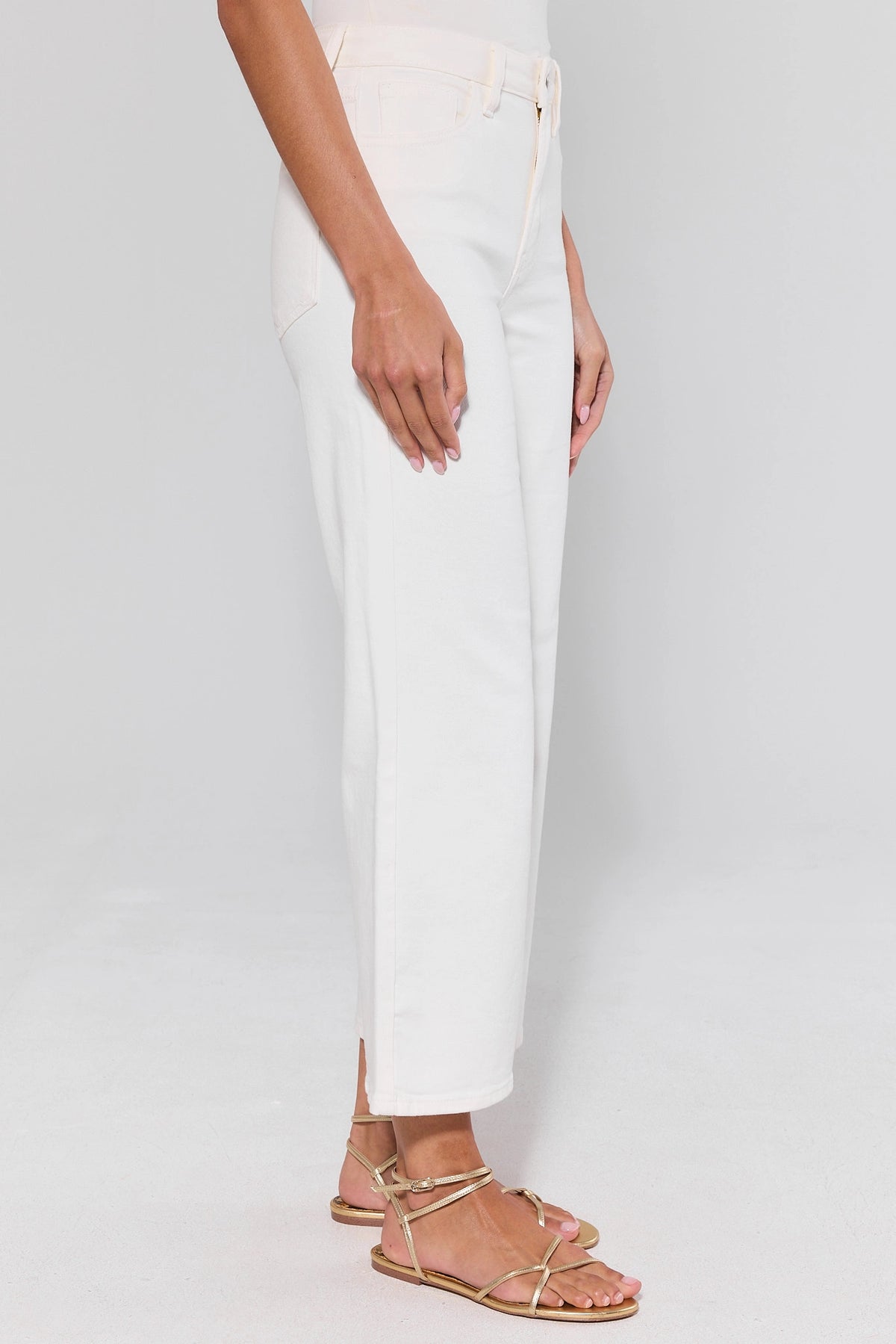 Hailey White Wide Leg Cropped Jeans - Side Profile View with Gold Strappy Sandals | Avara