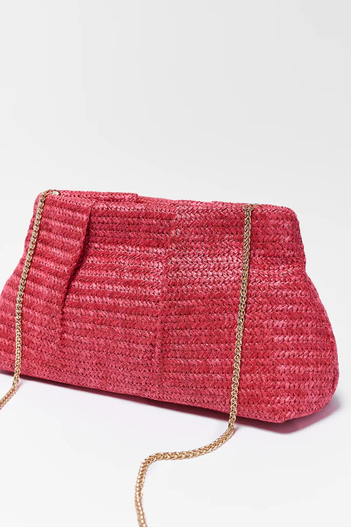 Pink woven raffia clutch bag with gold chain strap - Side Angle | Avara
