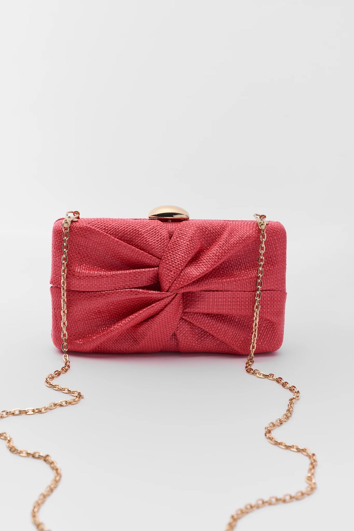 Pink Textured Knot Clutch with gold chain strap - Front View | Avara