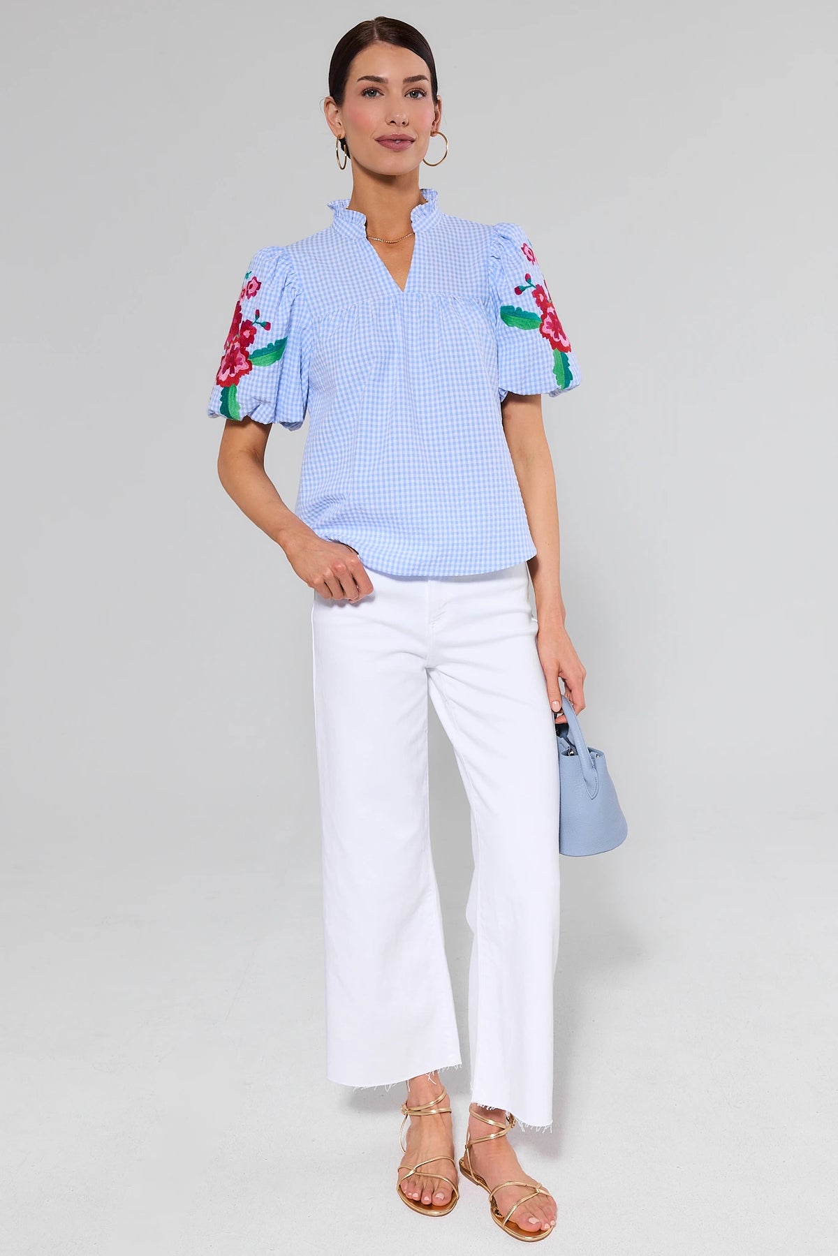 White wide leg jeans styled with blue gingham floral embroidery top and gold sandals, full outfit view | Avara