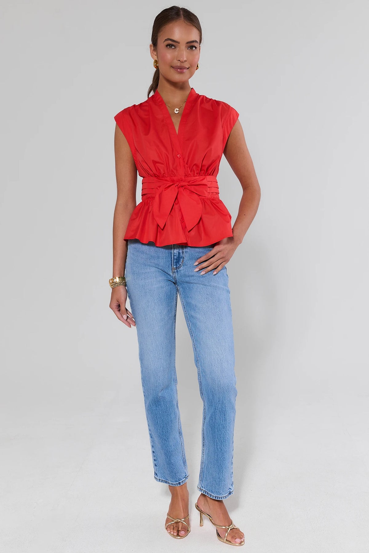 Red Button Up Tie Waist Top styled with blue jeans and gold heels - Full Length Front | Avara