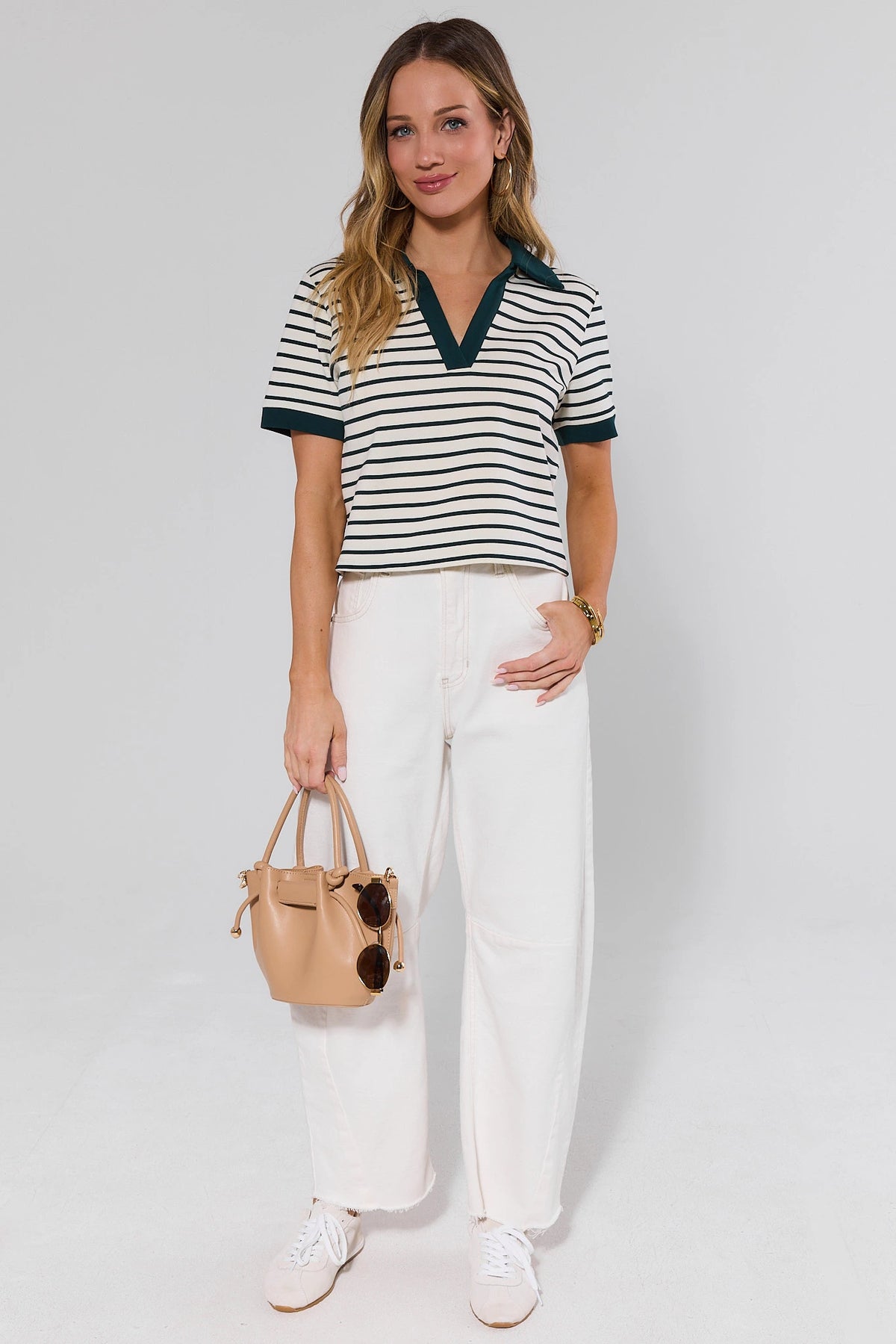 Green Striped Short Sleeve Top styled with white wide-leg pants and tan bag, full look | Avara