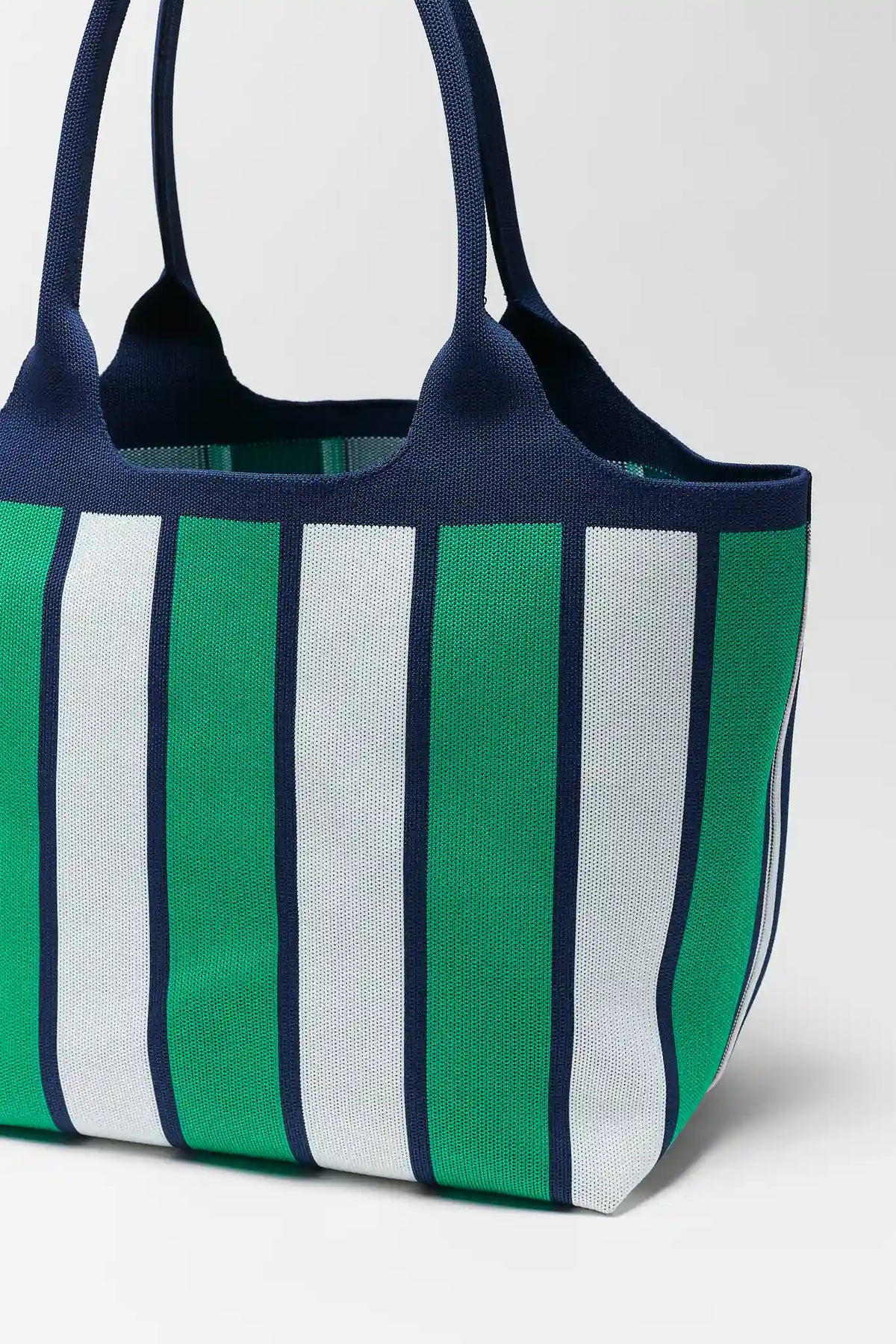 Green, white, and navy woven striped tote bag with navy contrast trim - Close-Up Detail | Avara