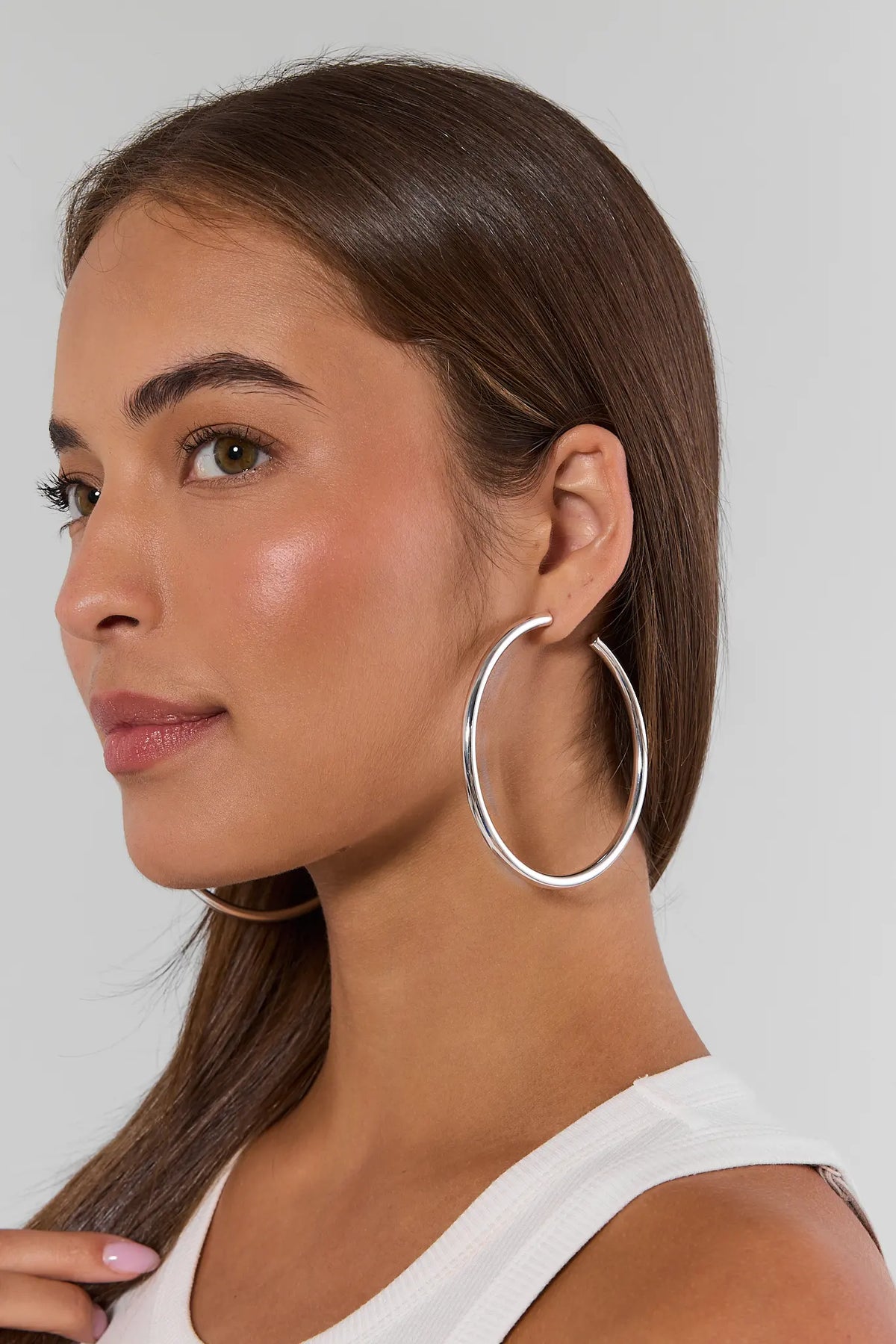 Emily Large Silver Hoop Earrings on model, side profile close-up | Avara