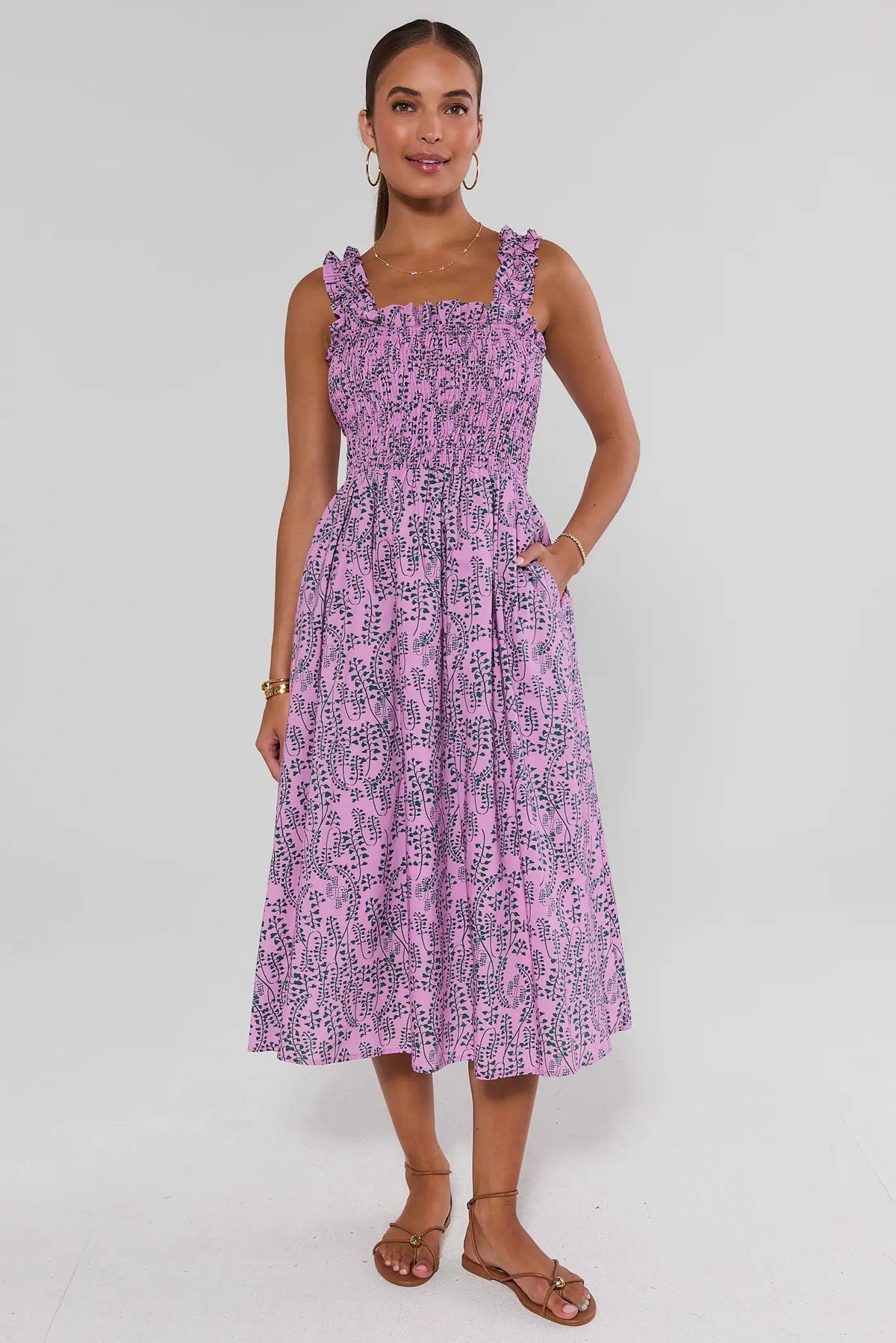 Pink Printed Smocked Midi Dress full-length front view, flowy A-line skirt with pockets, styled with sandals | Avara