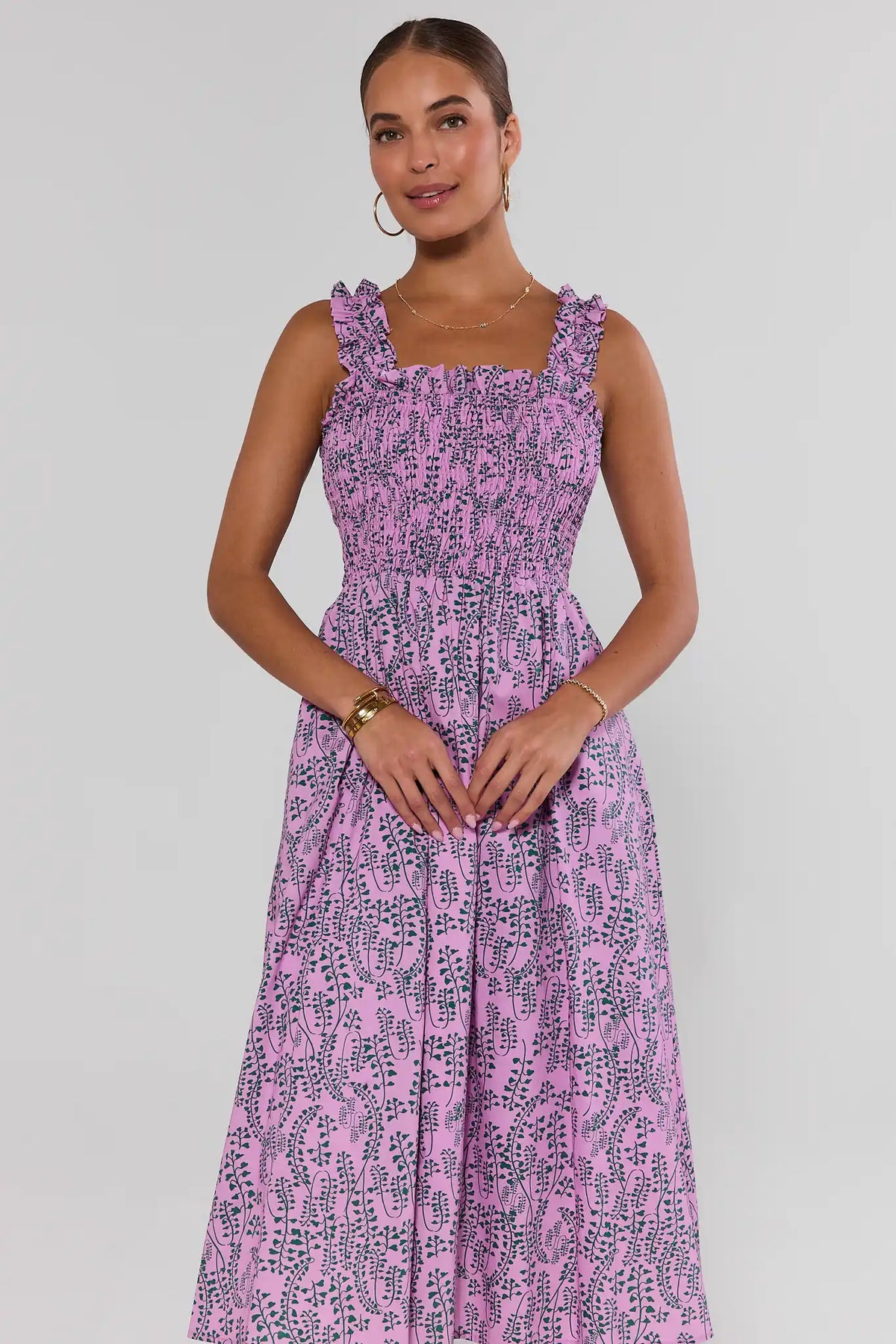 Pink Printed Smocked Midi Dress with green vine print, ruffled straps, front crop view on model | Avara