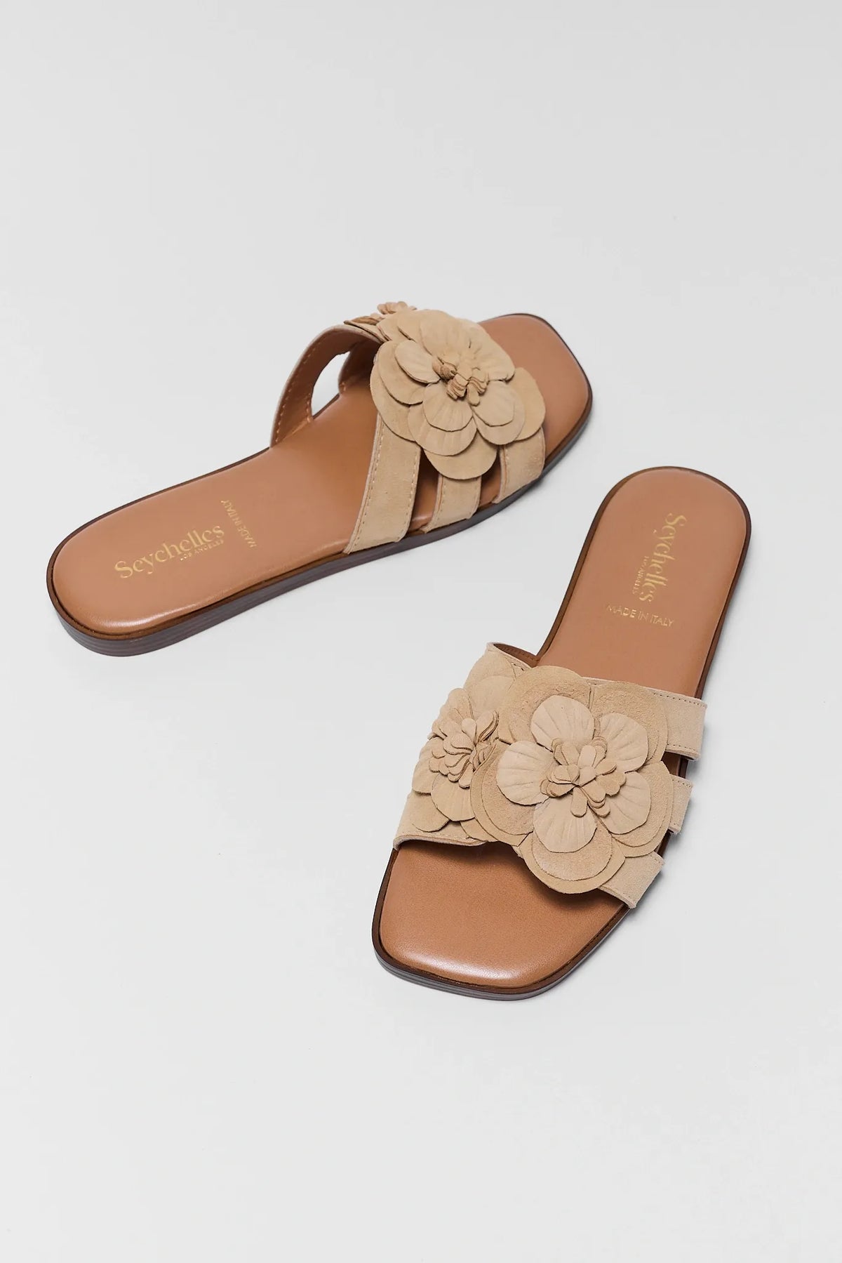 Tan suede floral appliqué slide sandals, angled pair view - Morning Dew by Seychelles | Avara