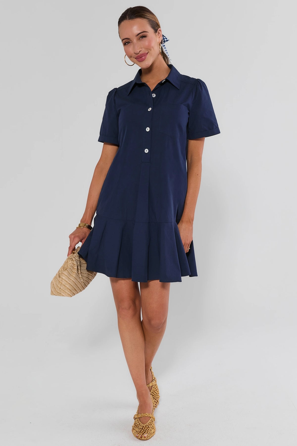 Meagan Navy Blue Drop Waist Shirt Dress styled with woven clutch and raffia sandals - Full Length | Avara