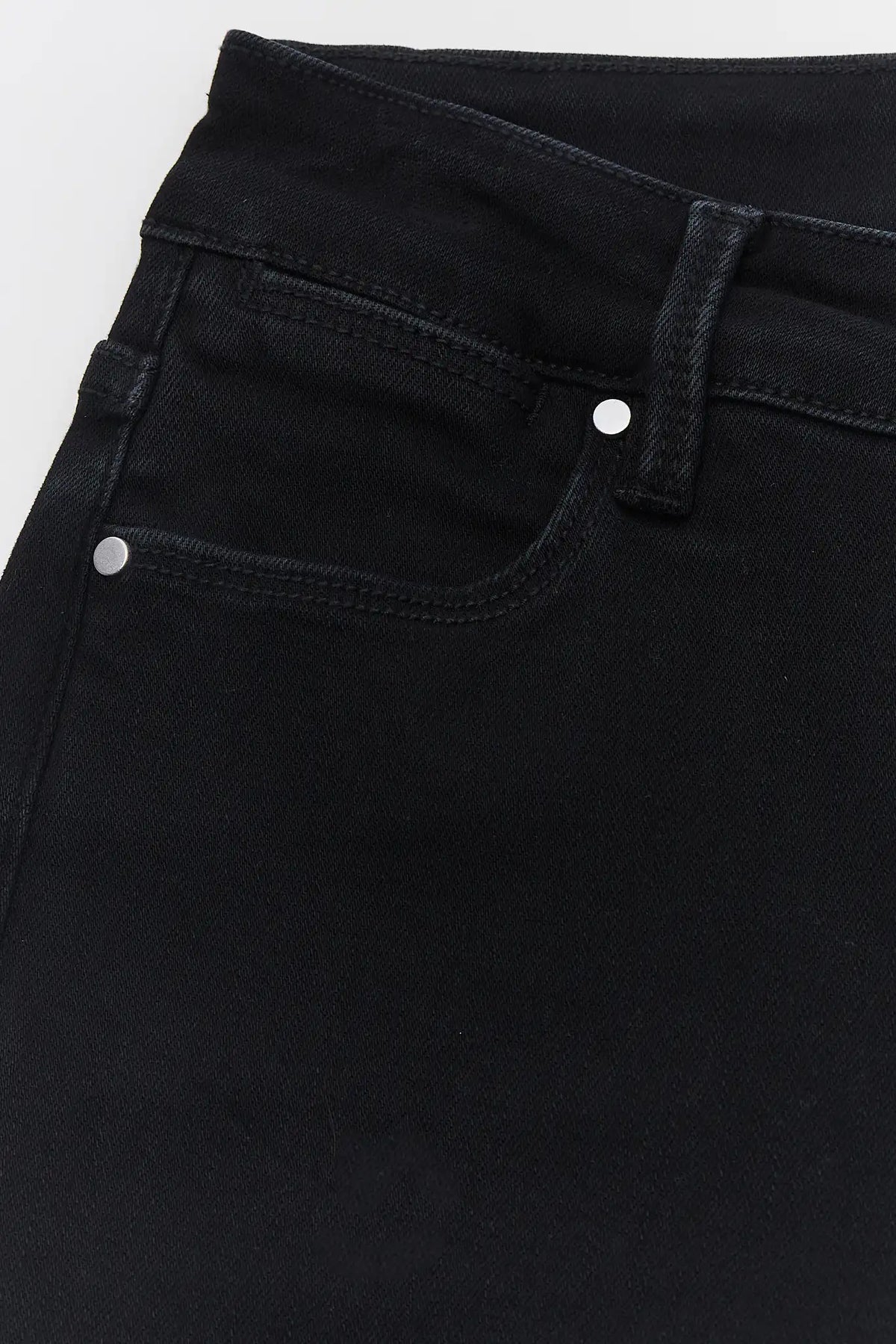 Black Denim Kick Flare Jeans - High-Rise Waistband and Silver Rivet Pocket Detail Close-Up | Avara