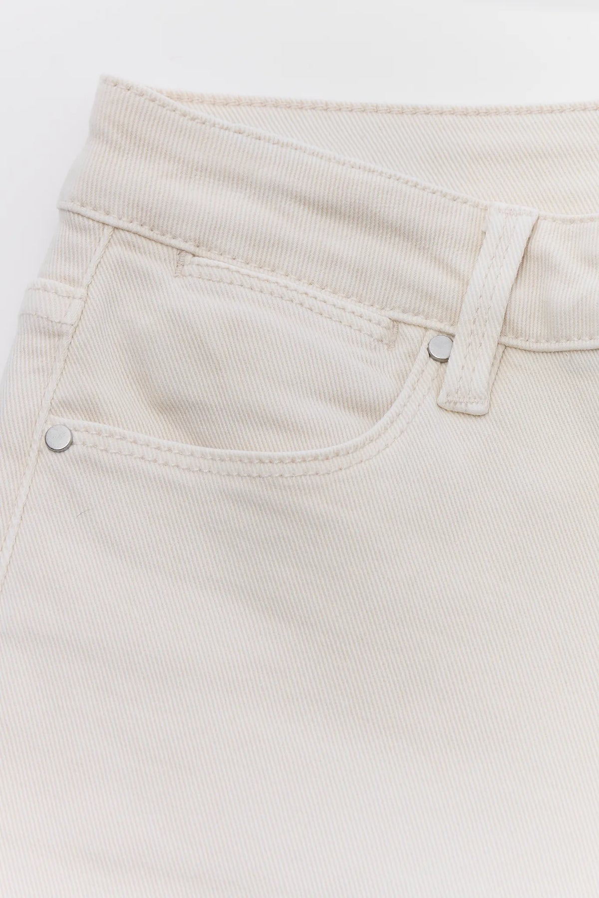 Ecru Straight Leg Denim Close-Up - Waistband, Front Pocket & Silver Hardware Detail | Avara