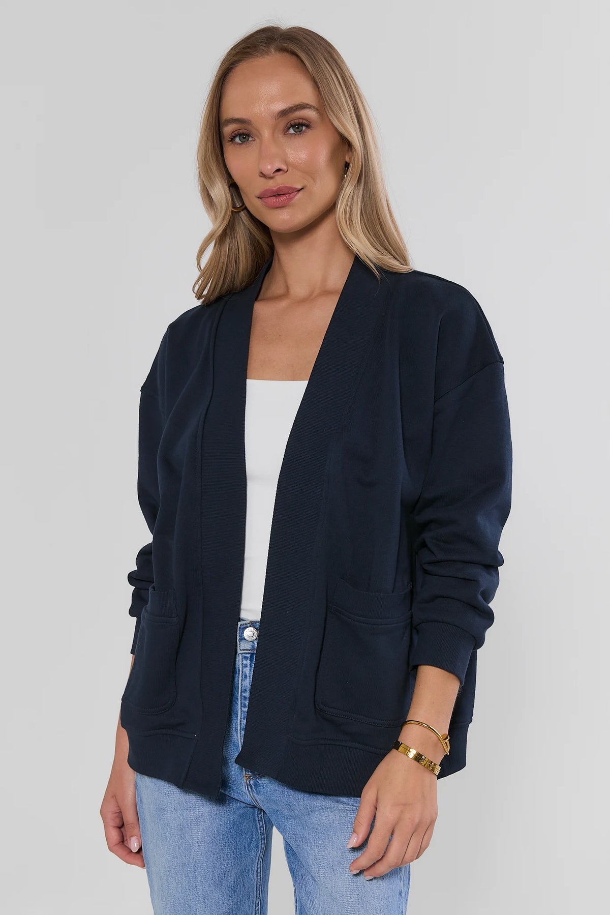 Navy Blue Open Front Cardigan - Front View On Model with Jeans | Avara