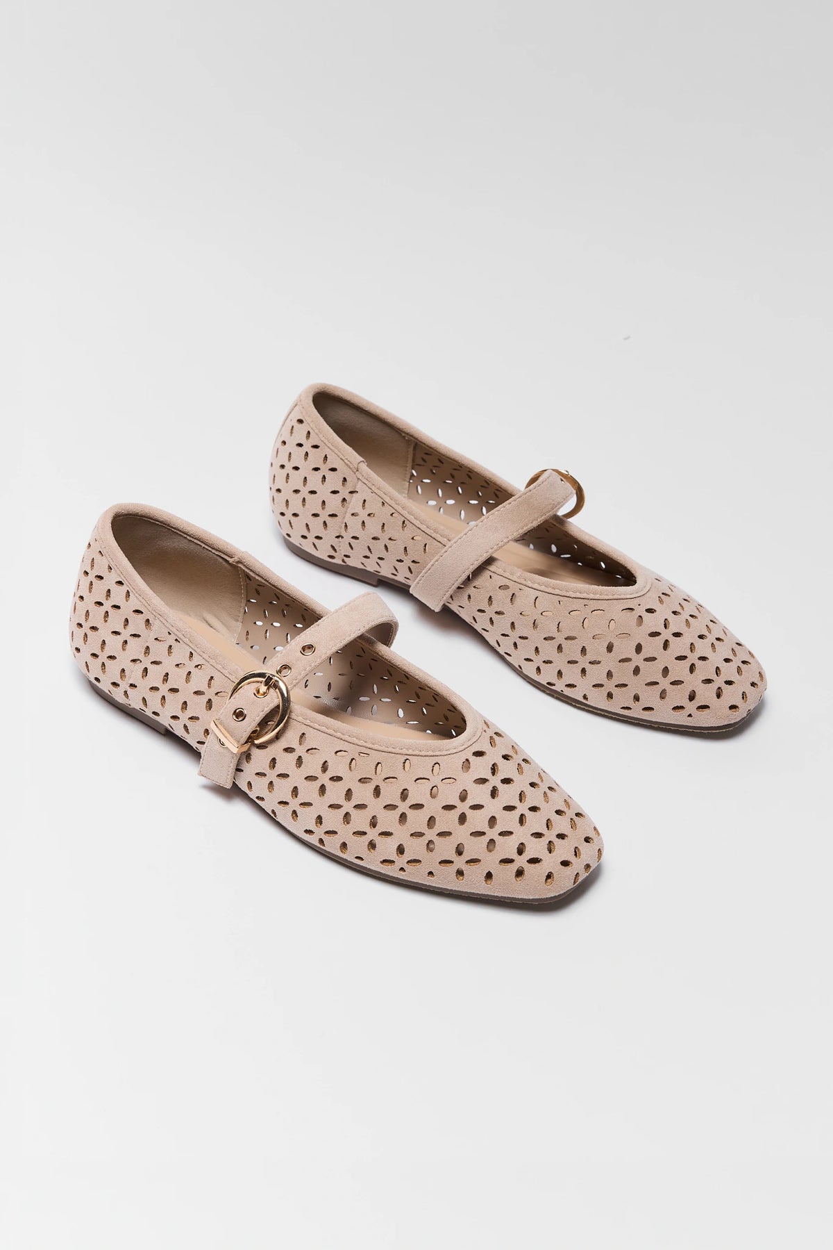 Pair of Taupe Faux Suede Ballet Flats with cutout detail and gold buckle - Angled View | Avara