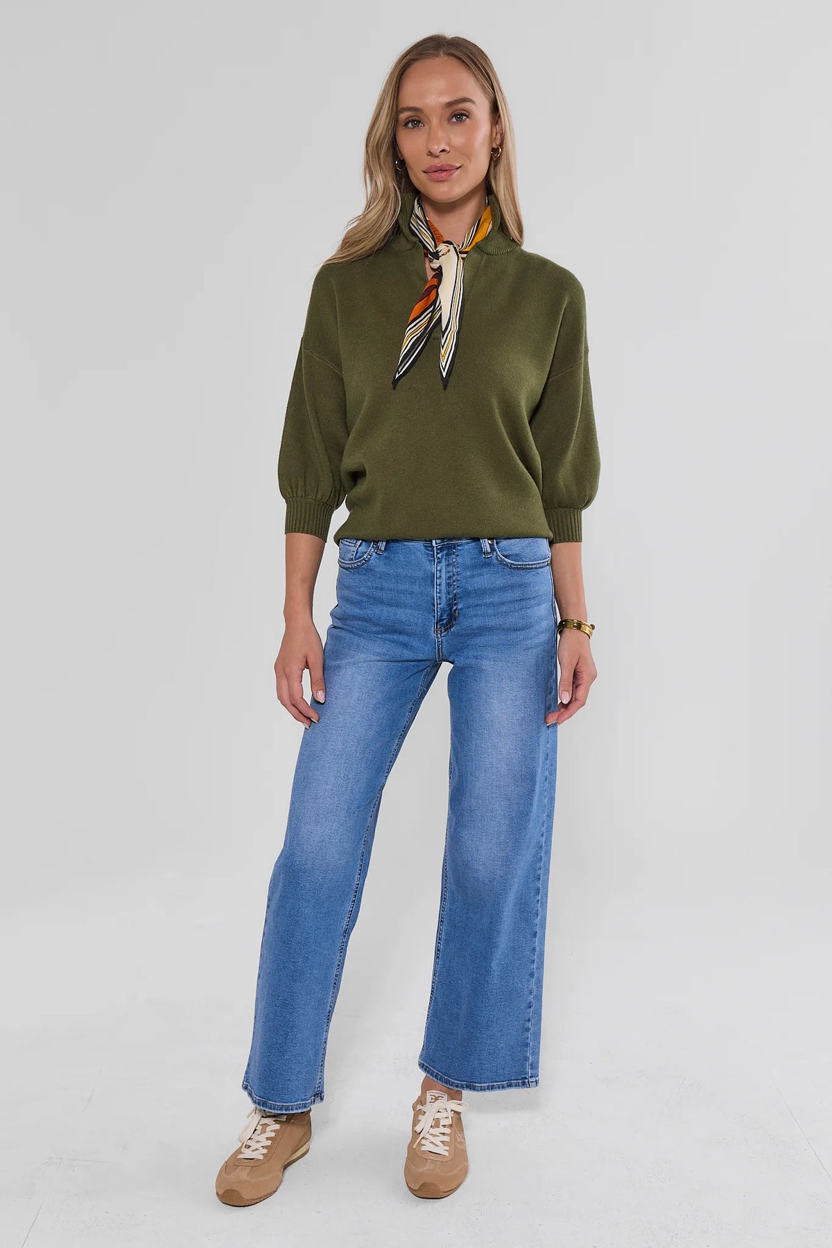 Medium Wash Straight Leg Jeans Styled with Olive Sweater - Full Length Front View | Avara