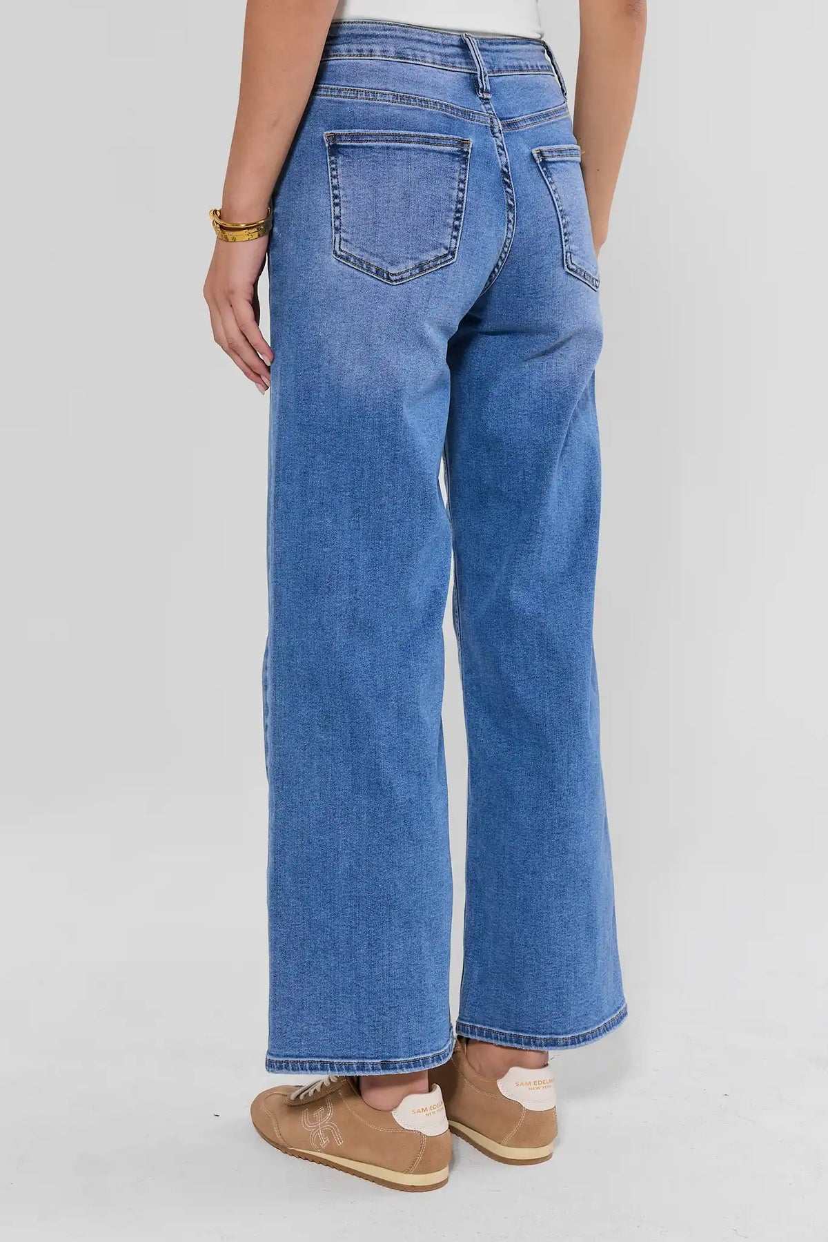 Medium Wash Straight Leg Jeans Back Pocket Detail - Rear View On Model | Avara